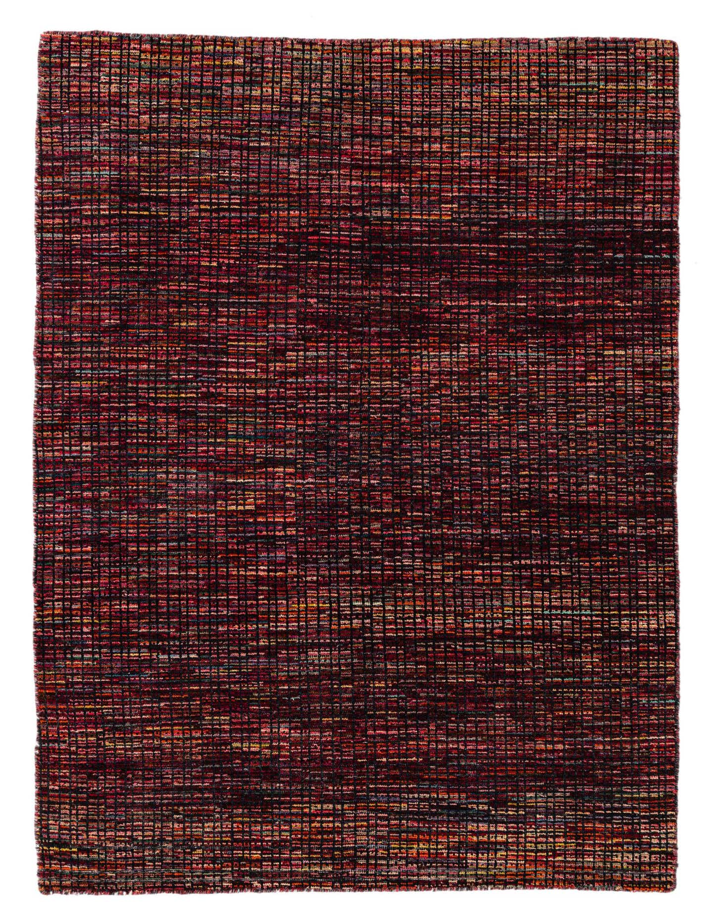A 5x8 rectangular Darya rug with a modern, abstract multi-colored pattern, featuring deep reds, oranges, and blues in a textured wool weave.