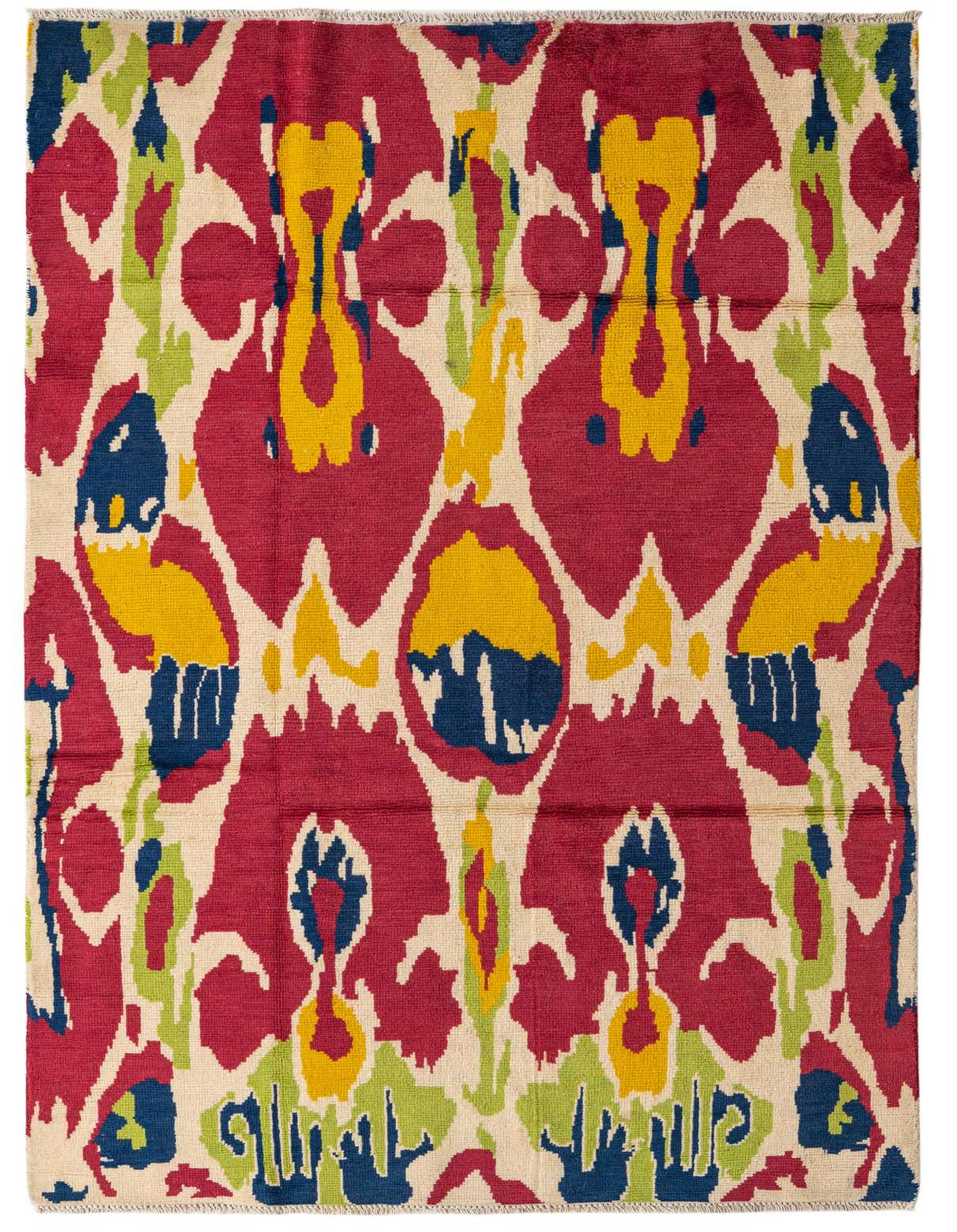 A vibrant 5x8 rectangular wool rug with a modern abstract pattern in red, yellow, blue, and green on a cream background.