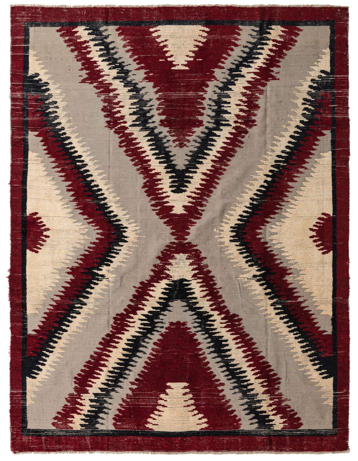 A rectangular 8x10 Darya rug with a modern abstract pattern in multi-colored wool, featuring bold red, black, and cream zigzags on a grey background.