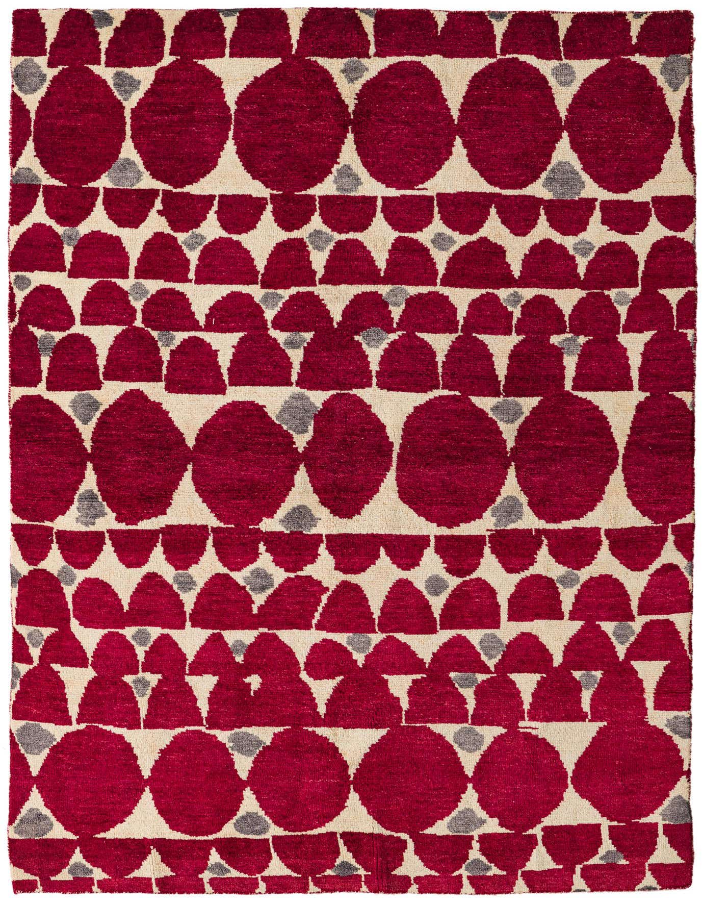 A 5x8 rectangular Darya rug with a modern abstract pattern of large and small deep red circles and half-circles on a cream background, accented with small gray dots.