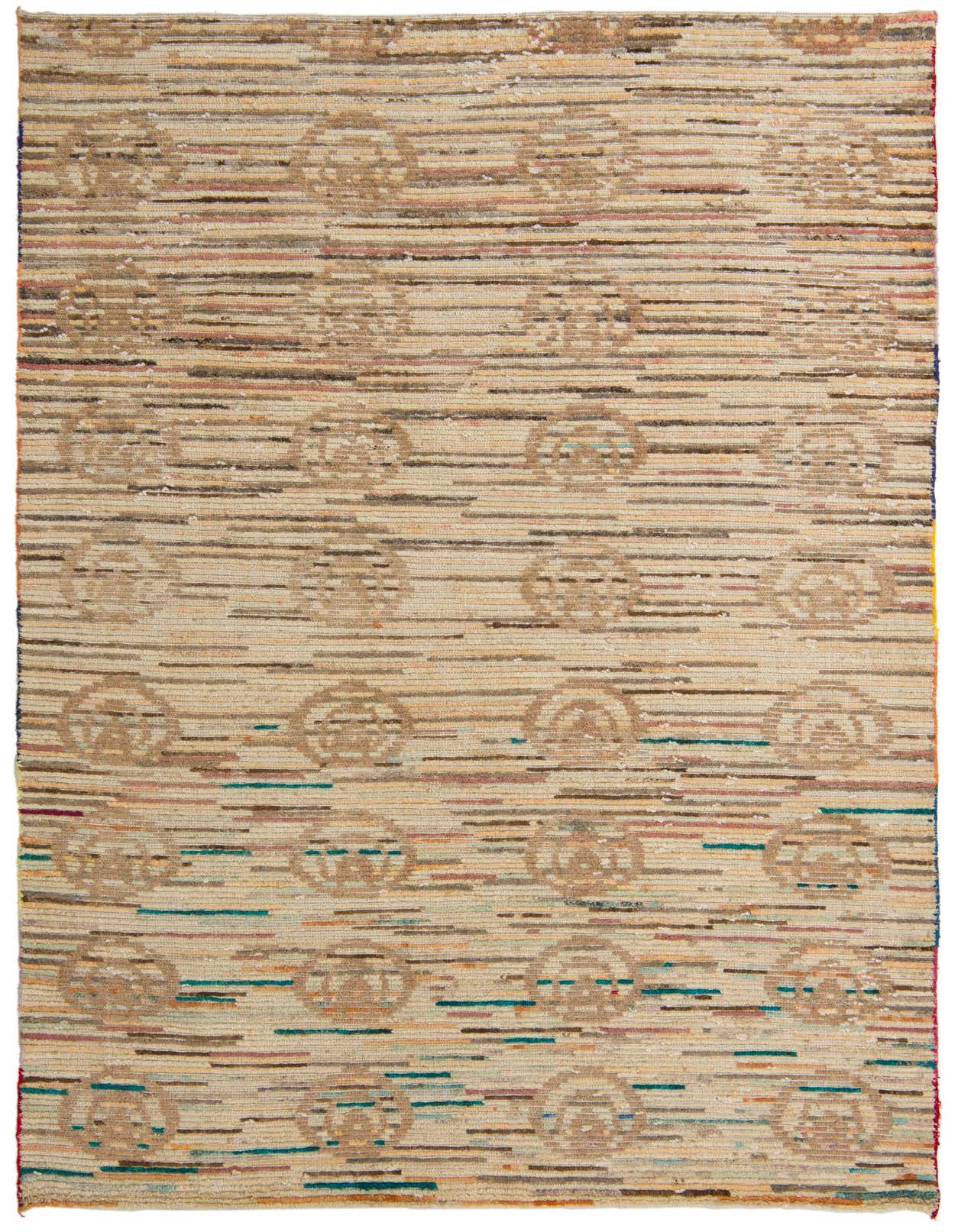 A rectangular 6x9 multi-colored wool rug with a modern abstract pattern and high pile, suitable for a living room.