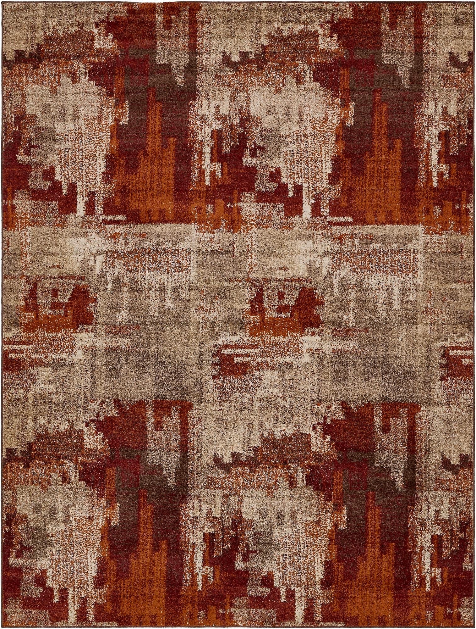 A large 9x12 rectangular area rug featuring an abstract, multi-colored pattern in shades of rust, orange, brown, and beige, suitable for a living room.