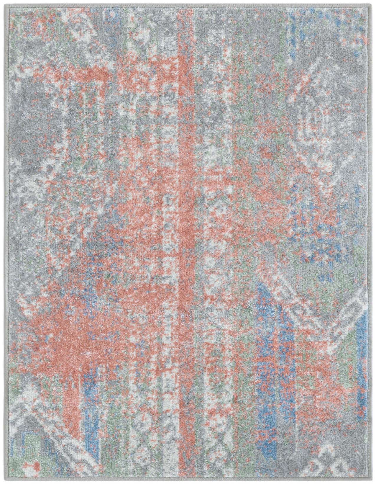 A 2x3 rectangular Kamala Washable rug featuring a distressed Southwestern pattern in multi-colored hues of grey, coral, blue, and green.