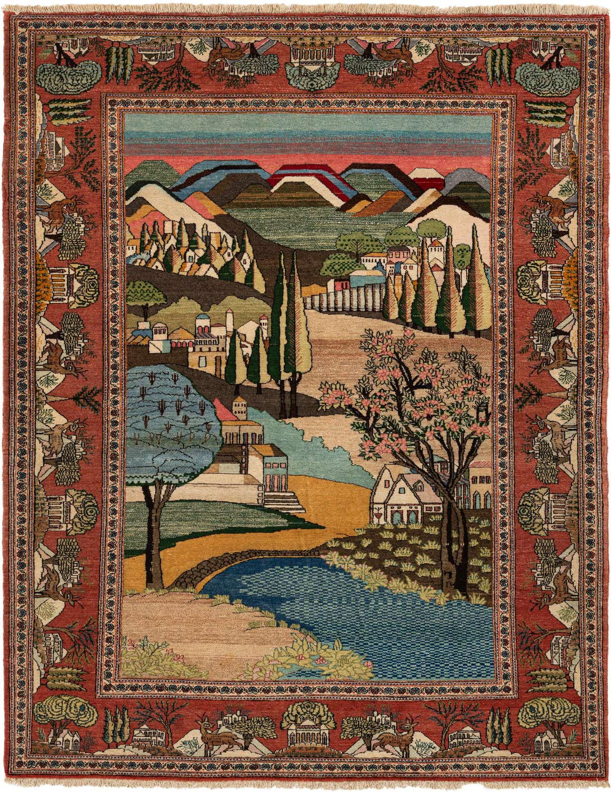 A 4x6 multi-colored Persian wool rug featuring a traditional village landscape scene with mountains, trees, houses, and a river, framed by a red floral border.