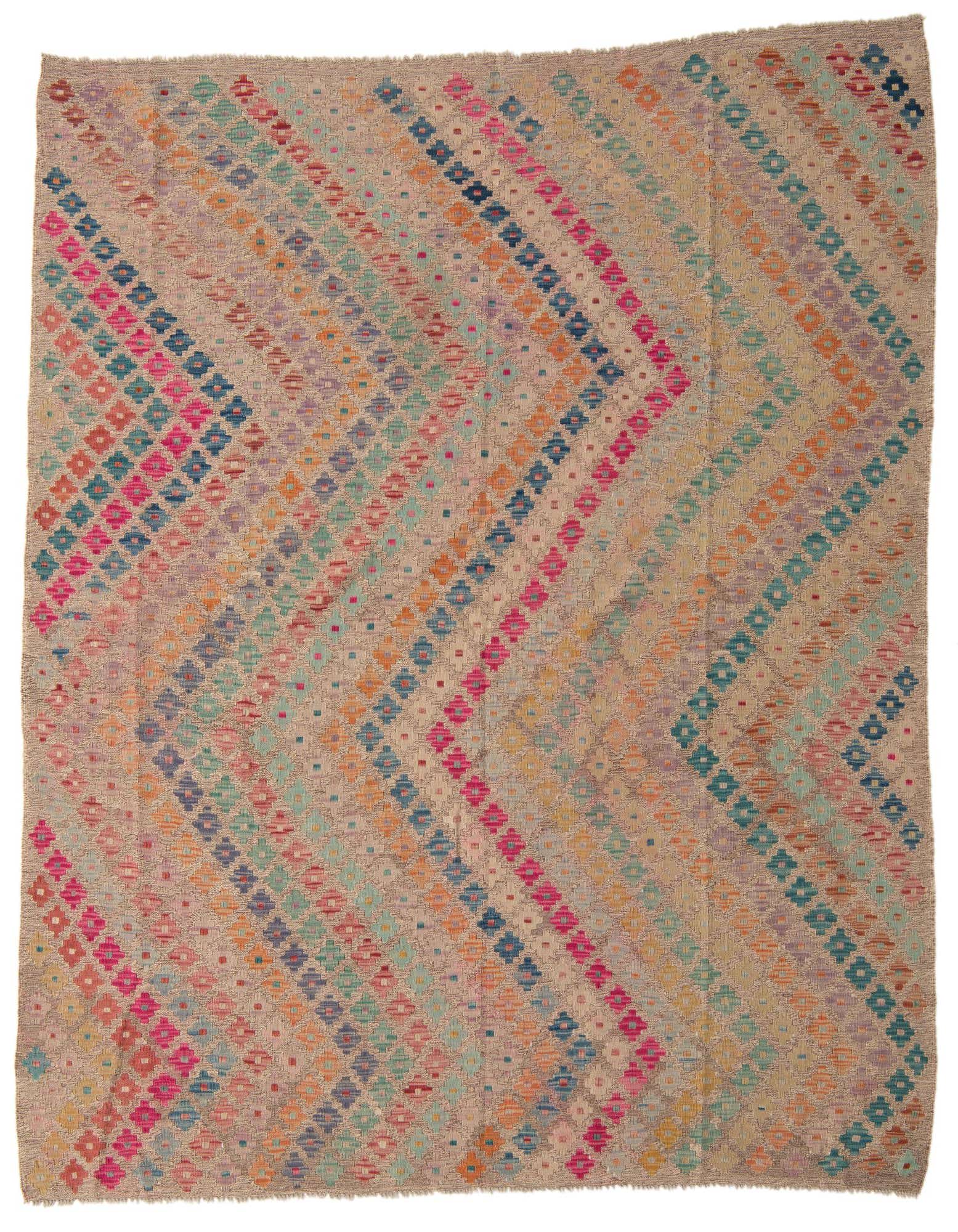 A 6x9 rectangular multi-colored wool flatweave rug with a Southwestern tribal pattern of zig-zagging diamond rows.