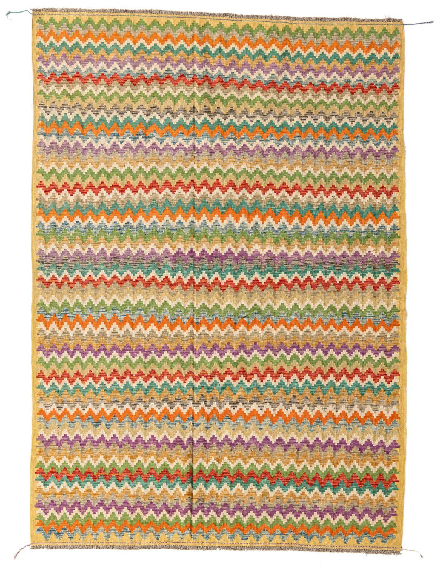 A 6x9 multi-colored rectangular wool rug with vibrant zigzag tribal patterns, ideal for a living room.