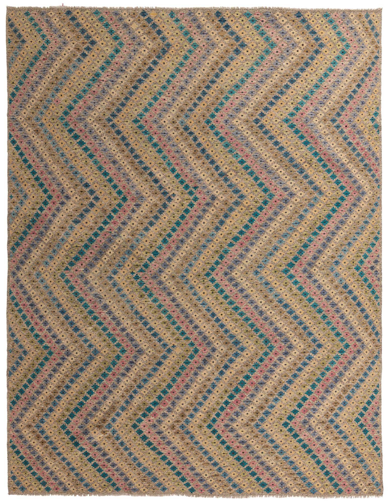 A 10x13 rectangular multi-colored tribal wool rug with a modern chevron pattern, ideal for a living room.