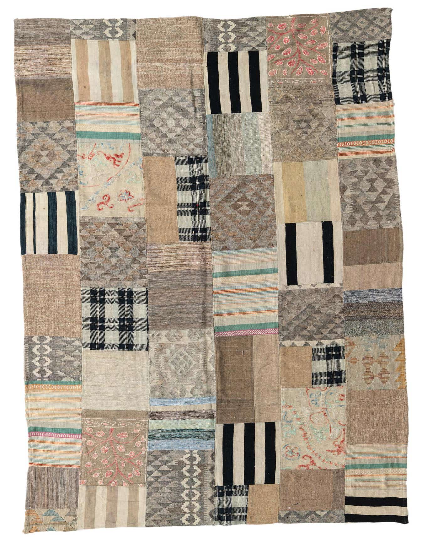 A rectangular 6x9 Kilim Patchwork rug with a multi-colored, flatweave design featuring Southwestern, tribal, and abstract patterns.