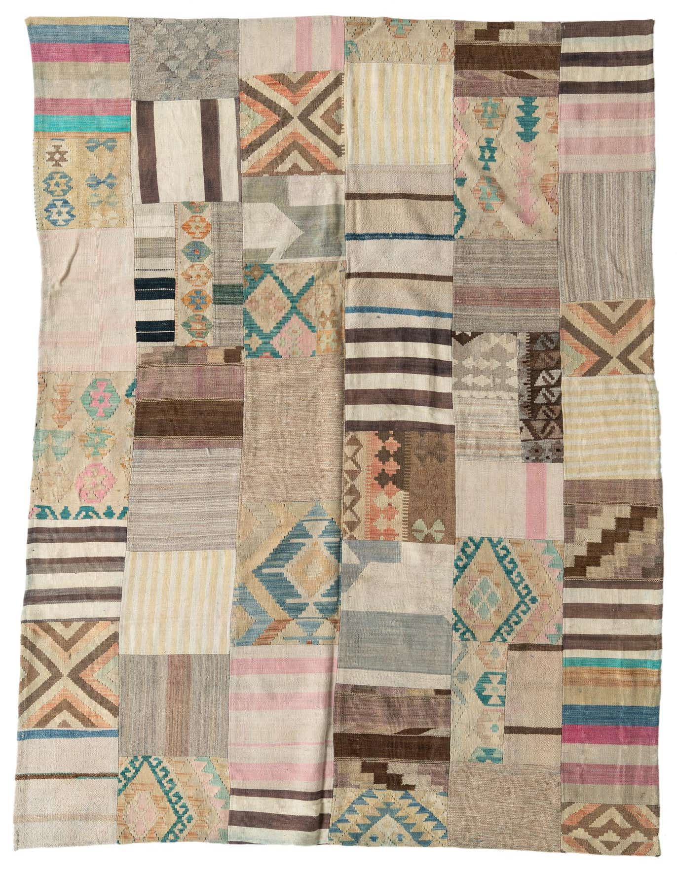 A 6x9 multi-colored rectangular wool flatweave rug with a patchwork design, featuring Southwestern and tribal patterns.