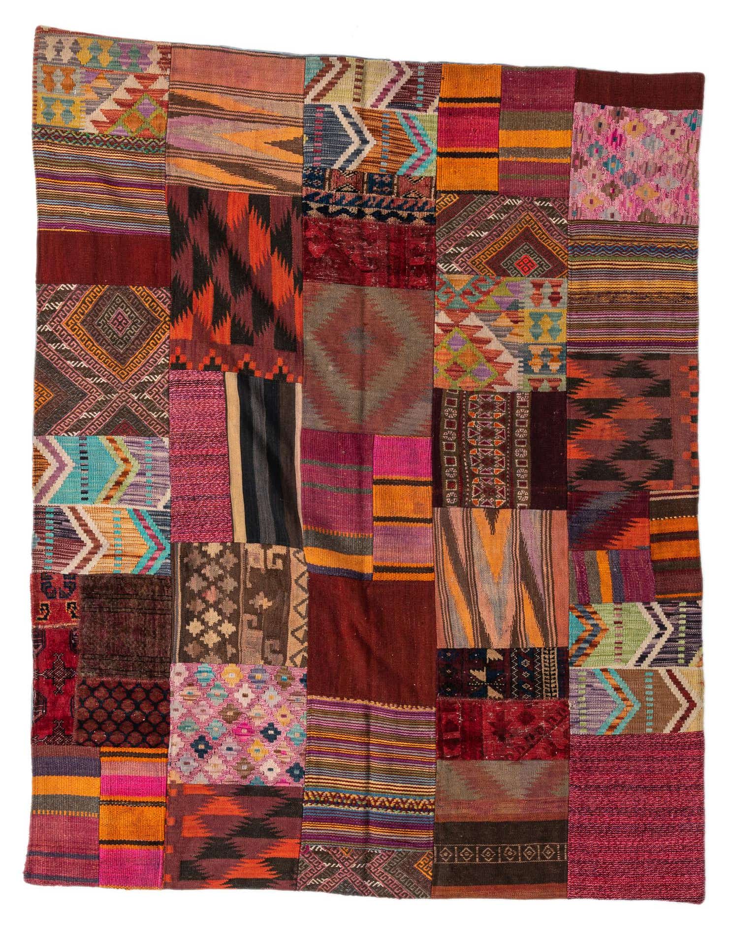 A vibrant 5x8 rectangular Kilim Patchwork rug, handmade from wool, featuring a multi-colored abstract tribal design.