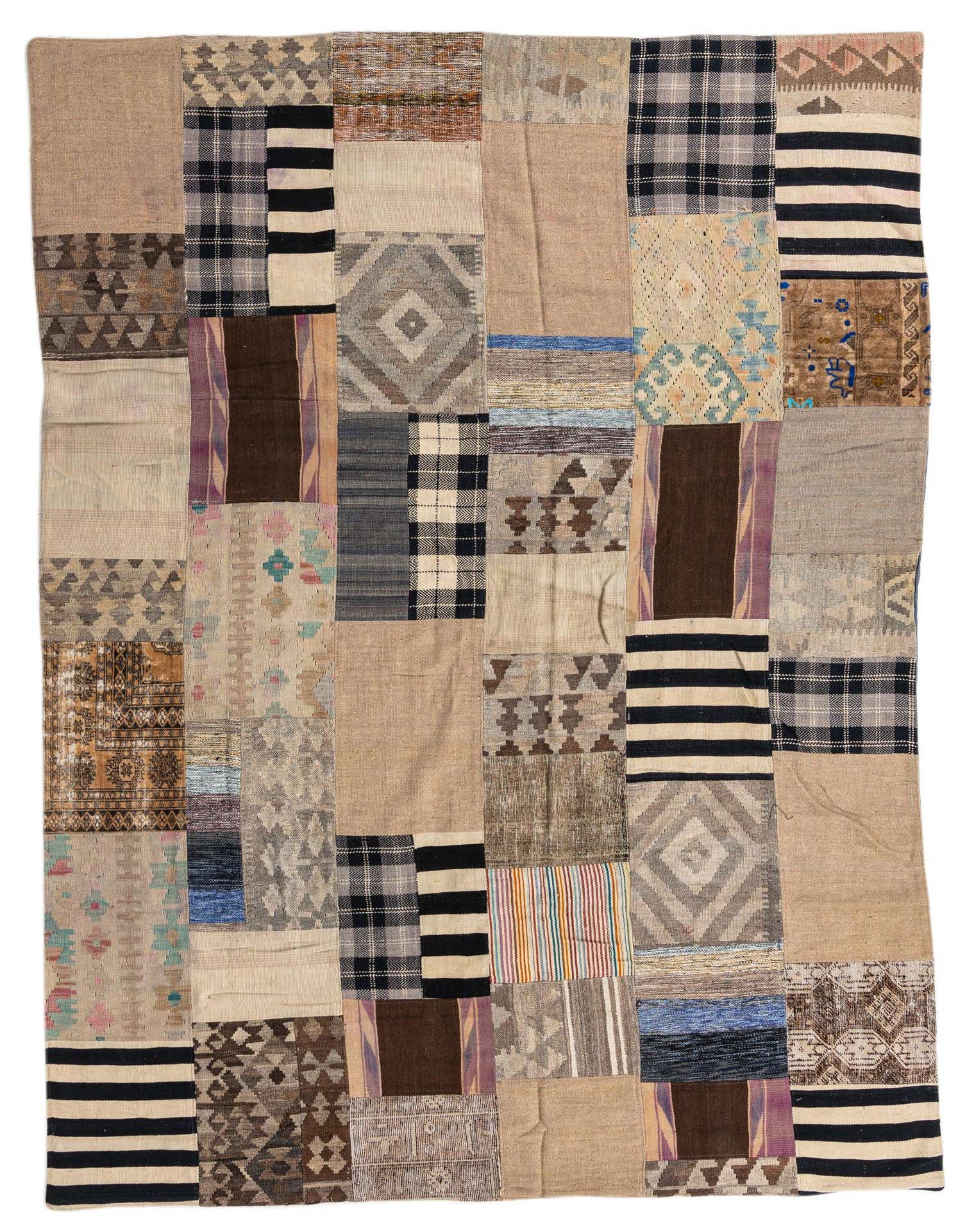 A 7x10 rectangular Kilim Patchwork rug featuring a multi-colored design with various Southwestern, tribal, and abstract patterns.