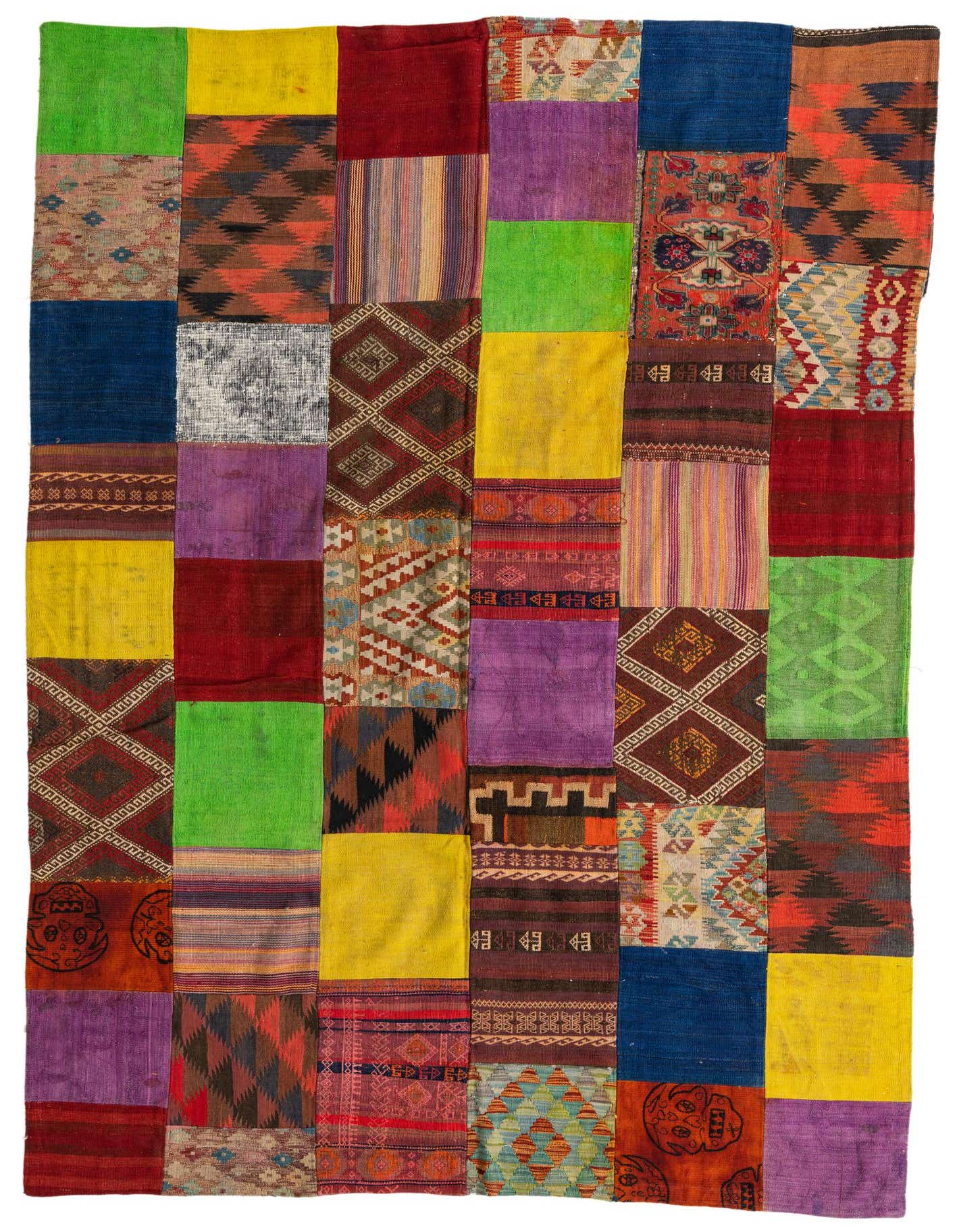 A vibrant 7x10 multi-colored rectangular Kilim Patchwork rug, handmade with various Southwestern and tribal patterns.