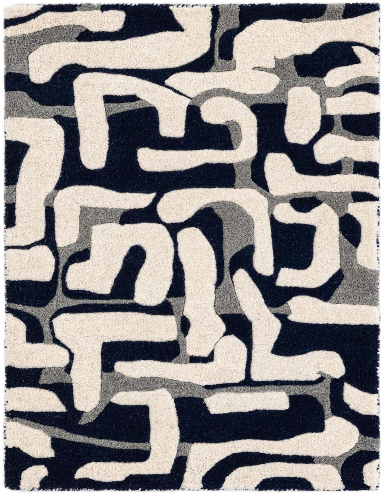 A 2x3 rectangular Luna Collection rug featuring a high pile and modern abstract pattern in navy, cream, and gray.