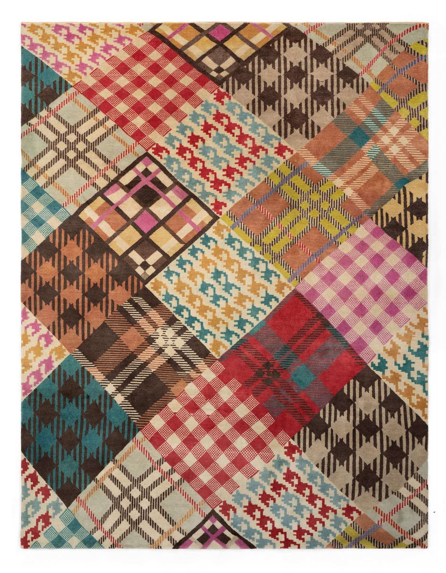 A vibrant 8x10 multi-colored rectangular wool rug featuring a patchwork of various plaid, houndstooth, and geometric patterns.