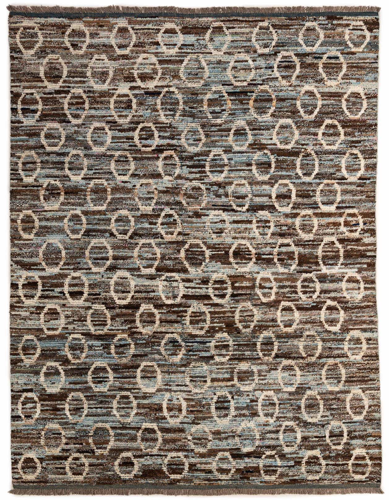 A 7x10 rectangular Moroccan rug with a multi-colored tribal pattern featuring brown, blue, and cream hues, suitable for a living room.