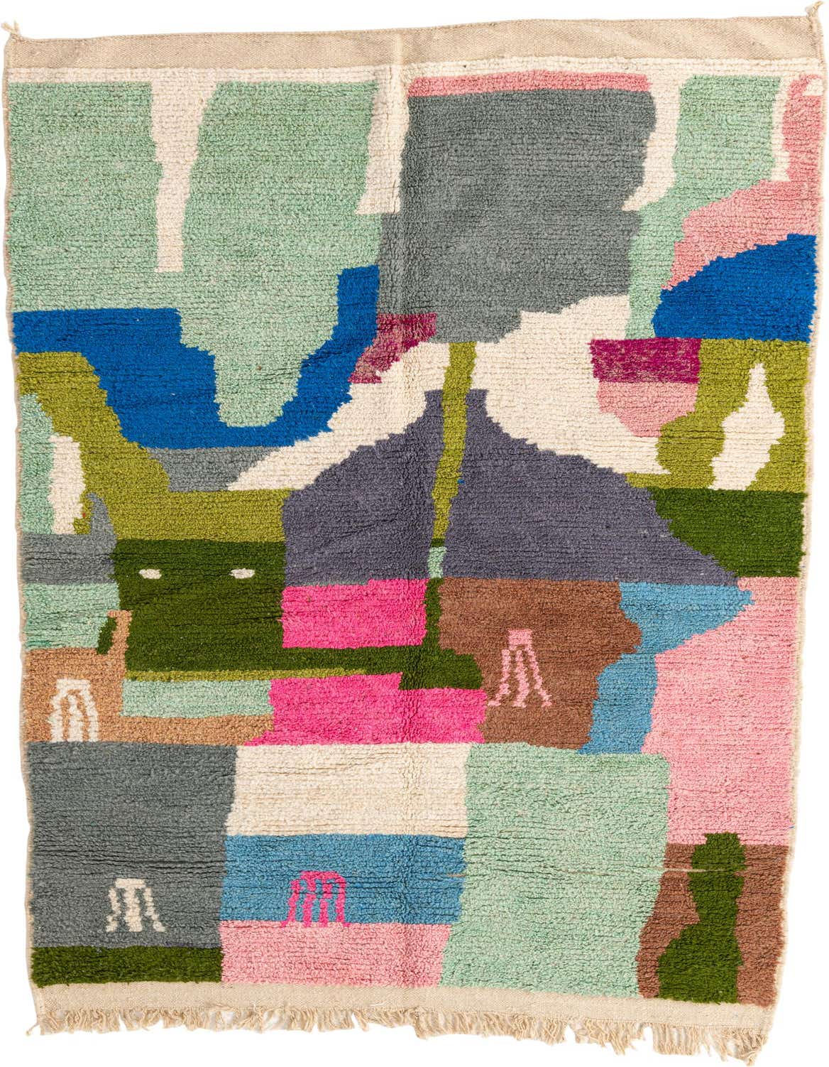 A 5x8 rectangular shag rug with a vibrant, multi-colored abstract tribal pattern, featuring shades of green, blue, pink, brown, and gray.