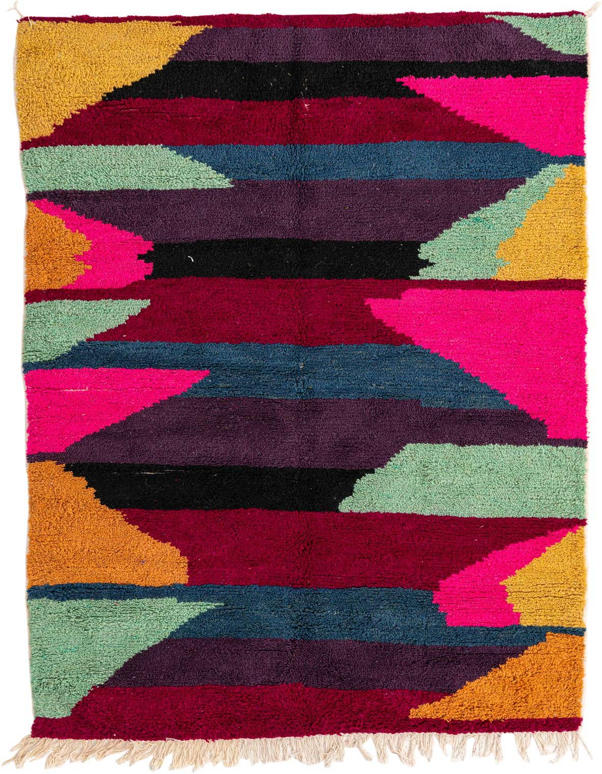 A 5x8 rectangular multi-colored shag rug with a modern tribal pattern in bold hues of red, pink, purple, blue, green, black, and yellow.
