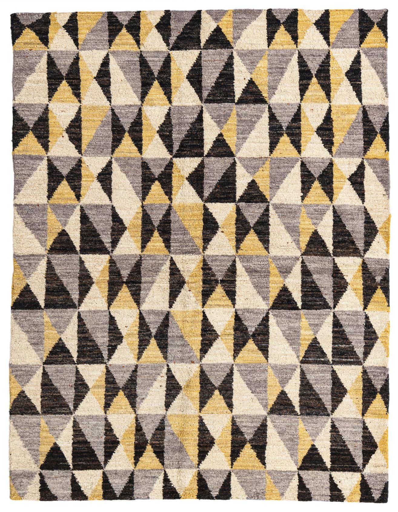 A 5x8 rectangular shag rug featuring a repeating geometric pattern of triangles in black, grey, cream, and yellow.