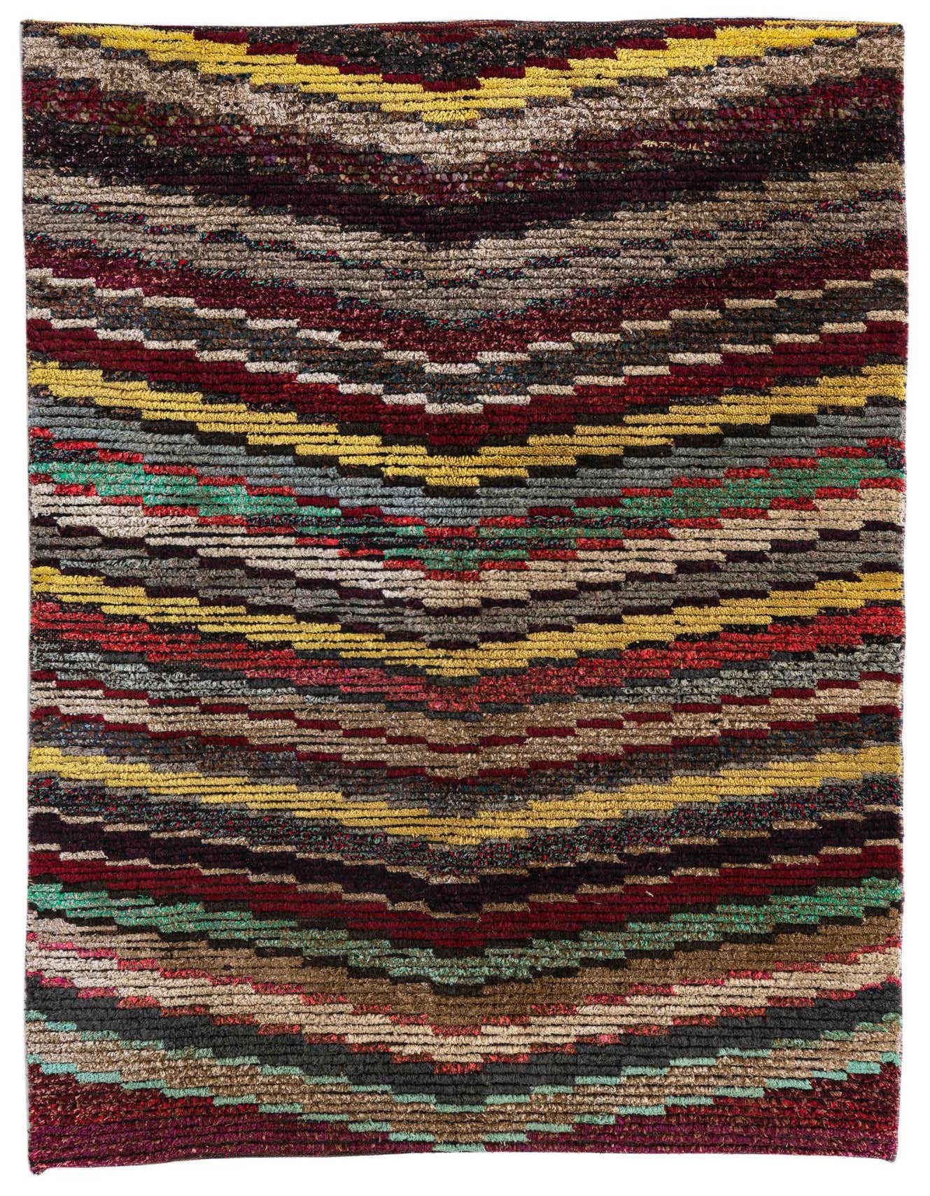 A 4x6 rectangular multi-colored shag rug with a tribal, modern, and abstract pattern, ideal for a living room or bedroom.