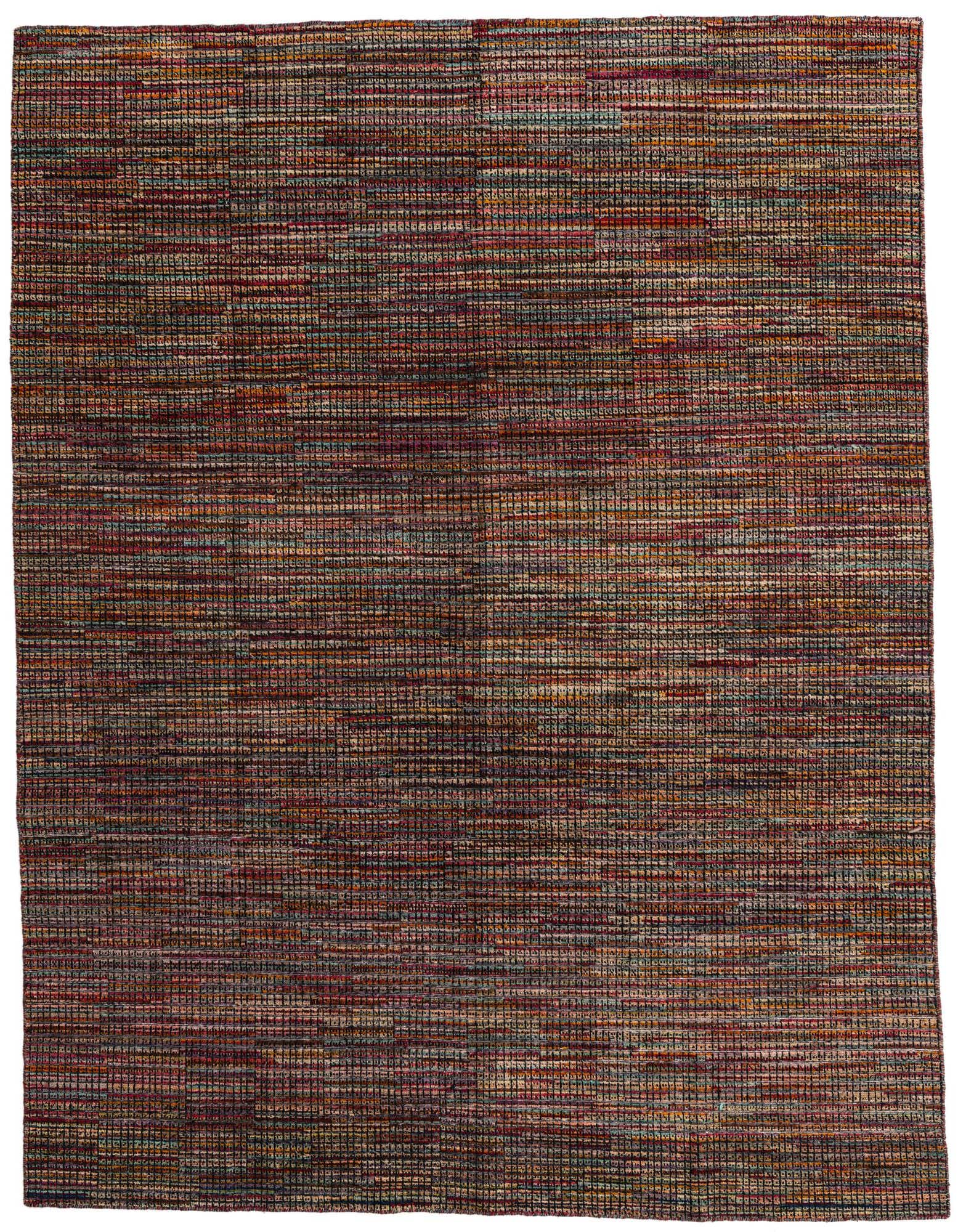 A rectangular 8x10 multi-colored shag rug with a tribal, modern, and abstract pattern, perfect for a living room.