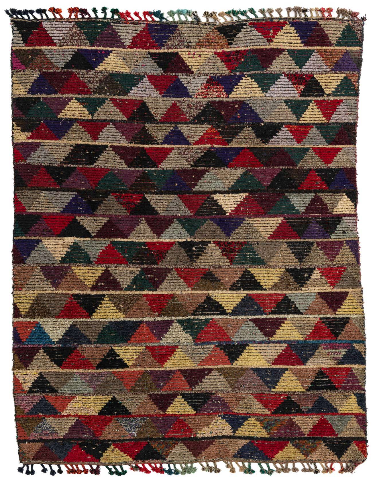 A 6x9 rectangular multi-colored wool shag rug with a vibrant tribal geometric pattern of triangles and tassels.