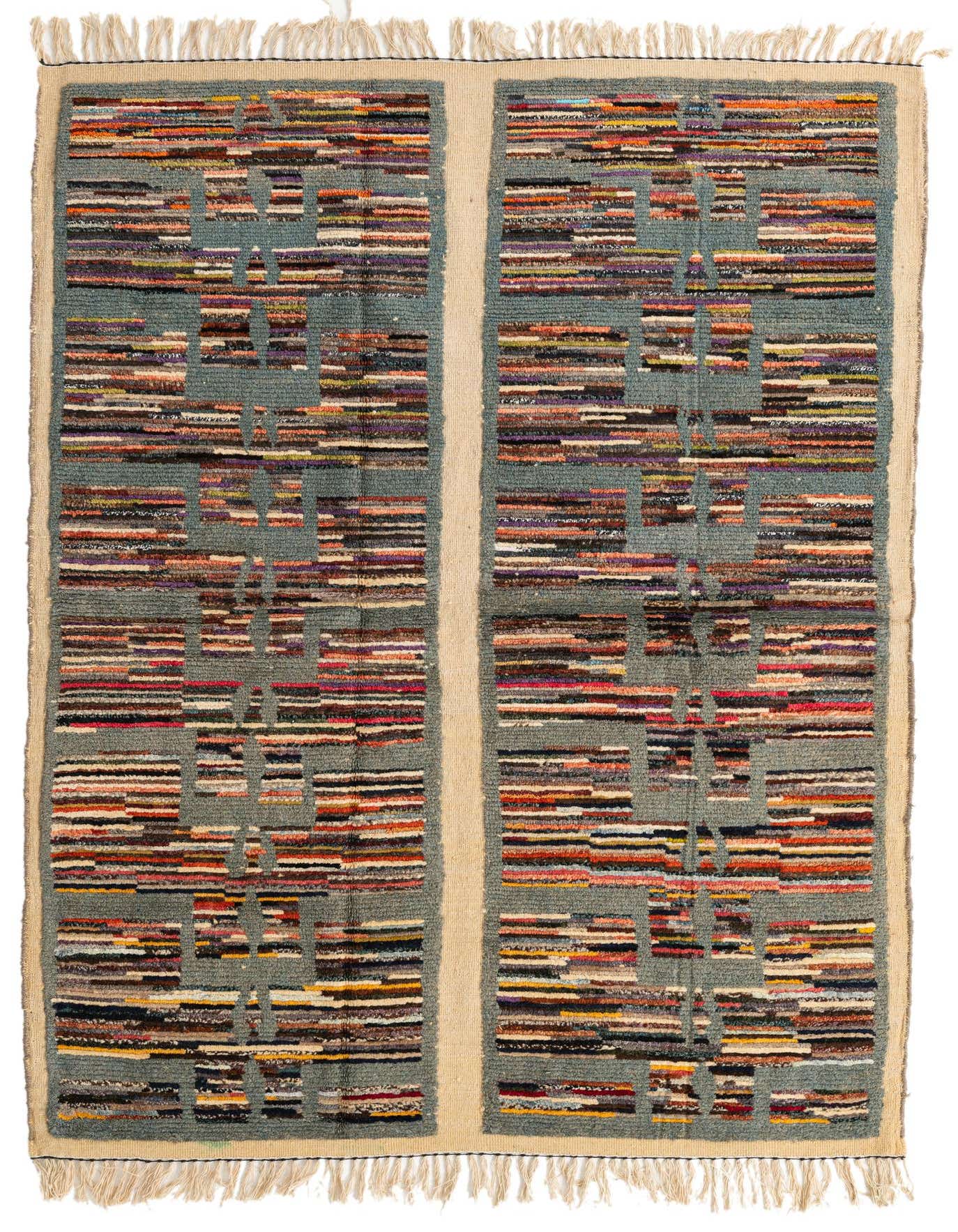 A 5x8 rectangular Moroccan shag rug featuring a multi-colored tribal stripe pattern on a light blue-green background with natural borders and fringe.
