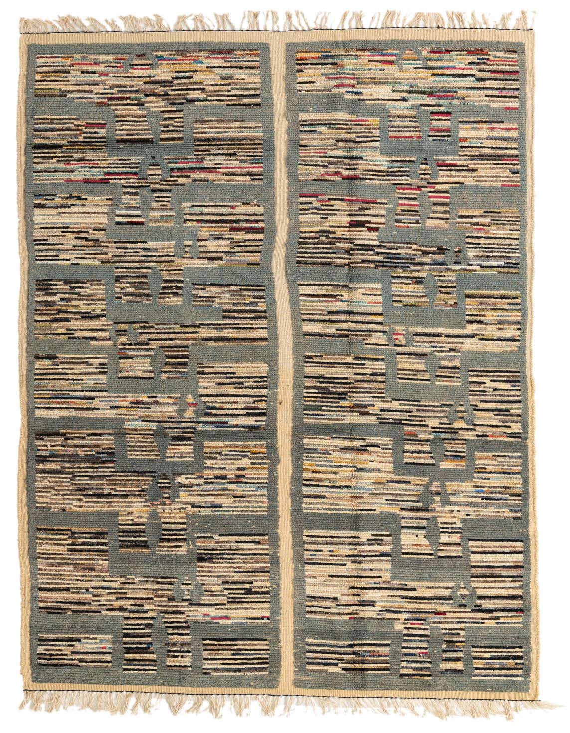 A 6x9 rectangular multi-colored wool shag rug with a modern tribal stripe pattern, ideal for a living room.