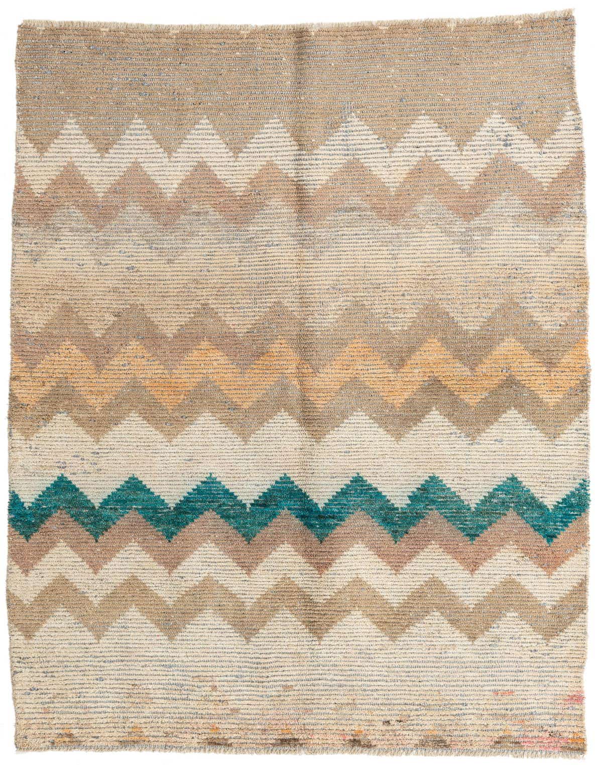 A 5x8 rectangular Moroccan shag rug with a multi-colored zigzag pattern in beige, brown, orange, and teal.