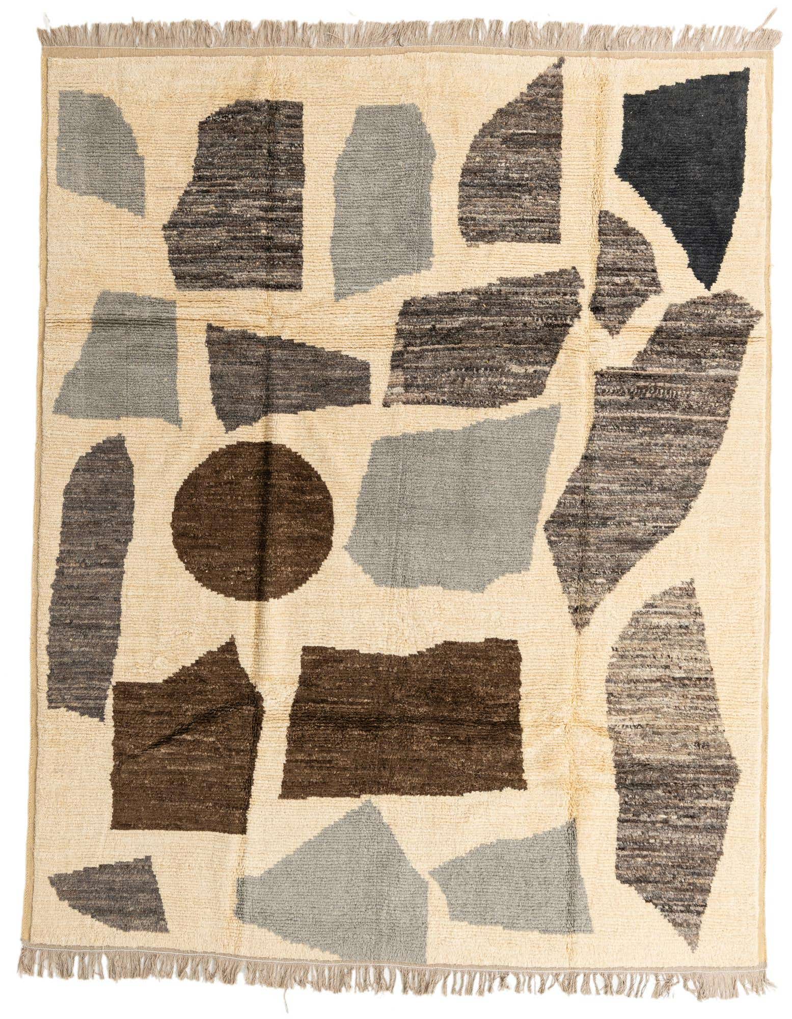 An 8x10 rectangular shag rug with an abstract tribal pattern in cream, grey, brown, and black.