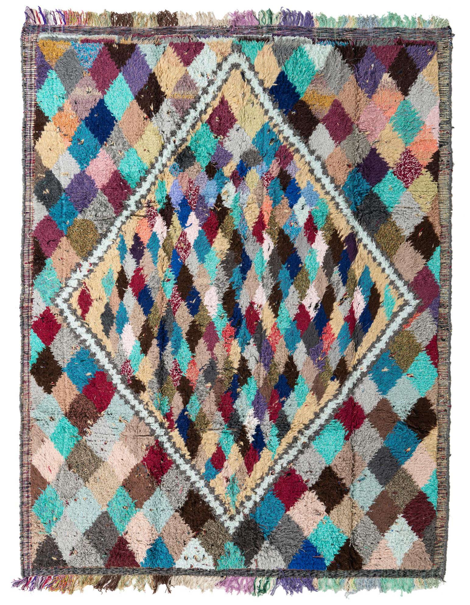 A vibrant 8x11 multi-colored shag rug with a tribal diamond pattern, perfect for a living room.