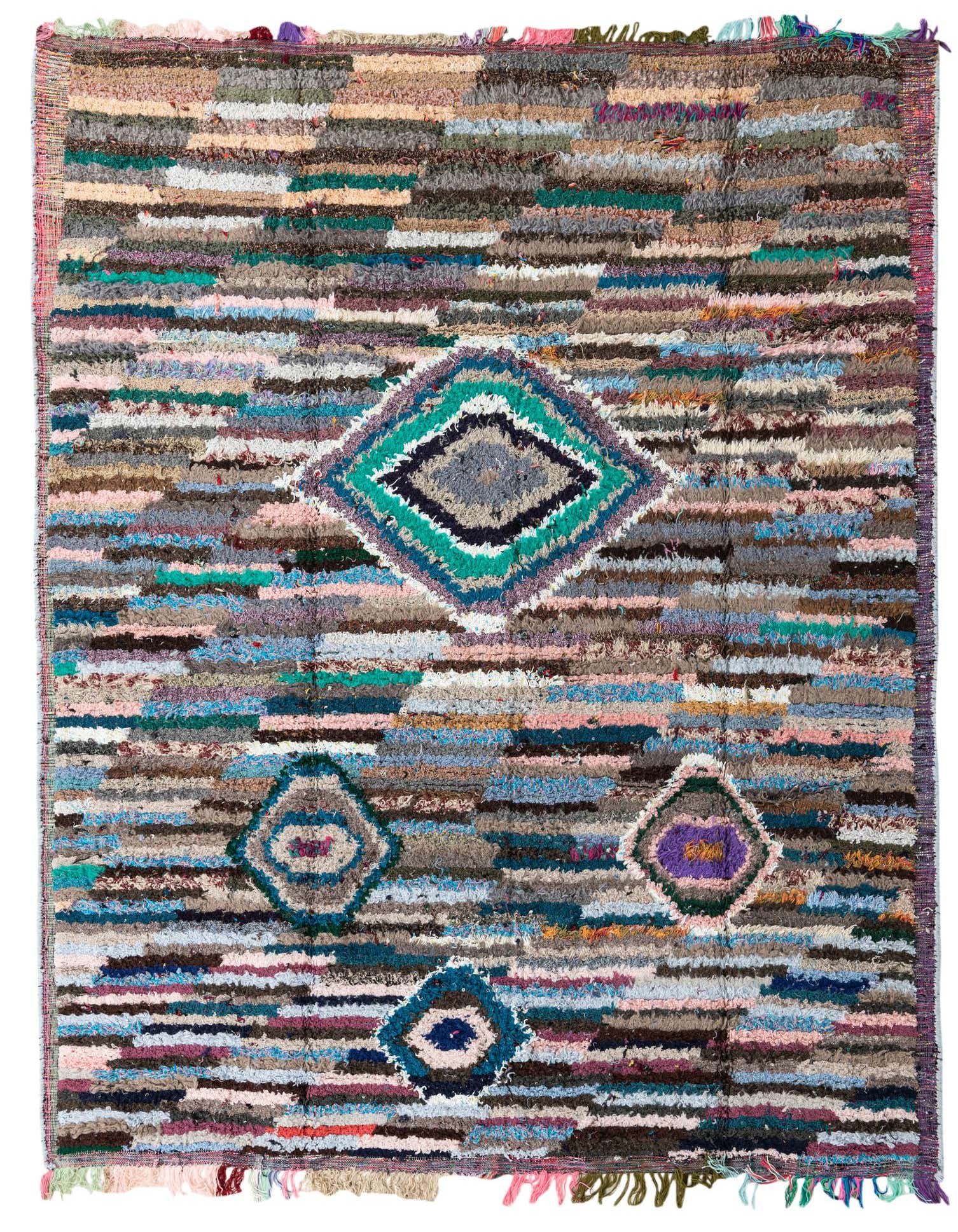 A vibrant 8x10 multi-colored shag rug with a tribal pattern, featuring horizontal stripes and central diamond motifs.