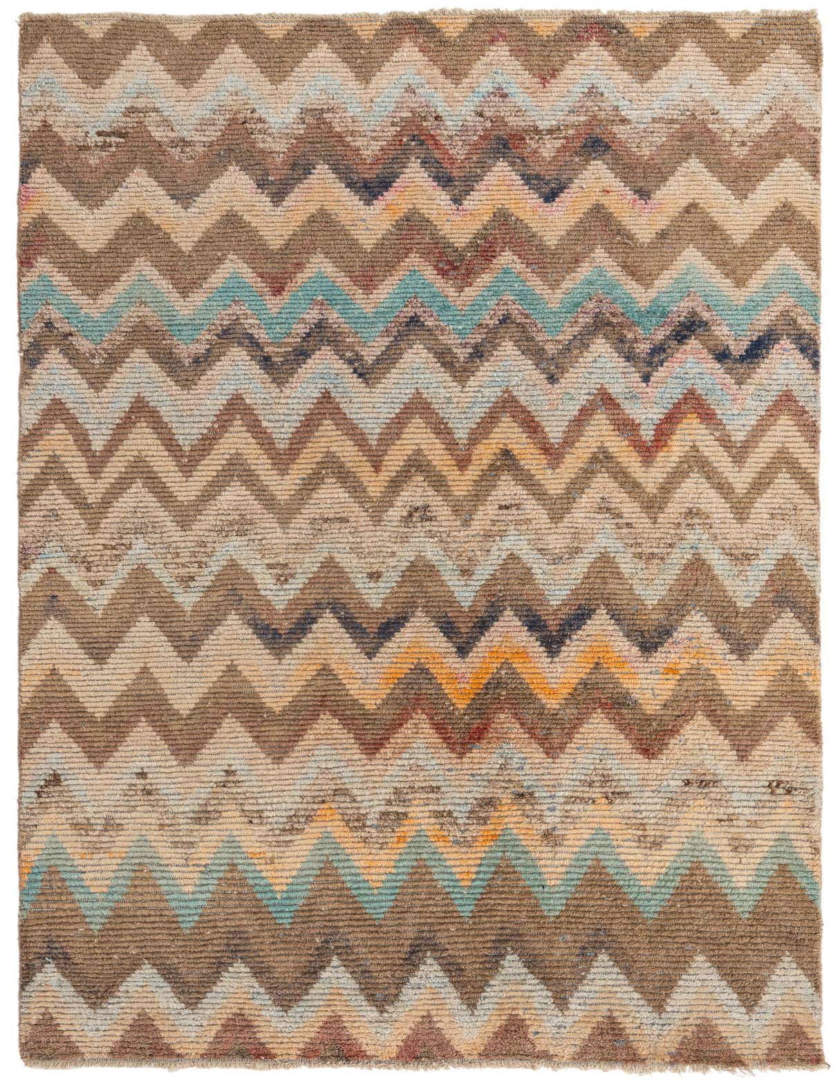 A 6x9 rectangular multi-colored wool shag rug with a vibrant tribal chevron pattern, ideal for a living room.