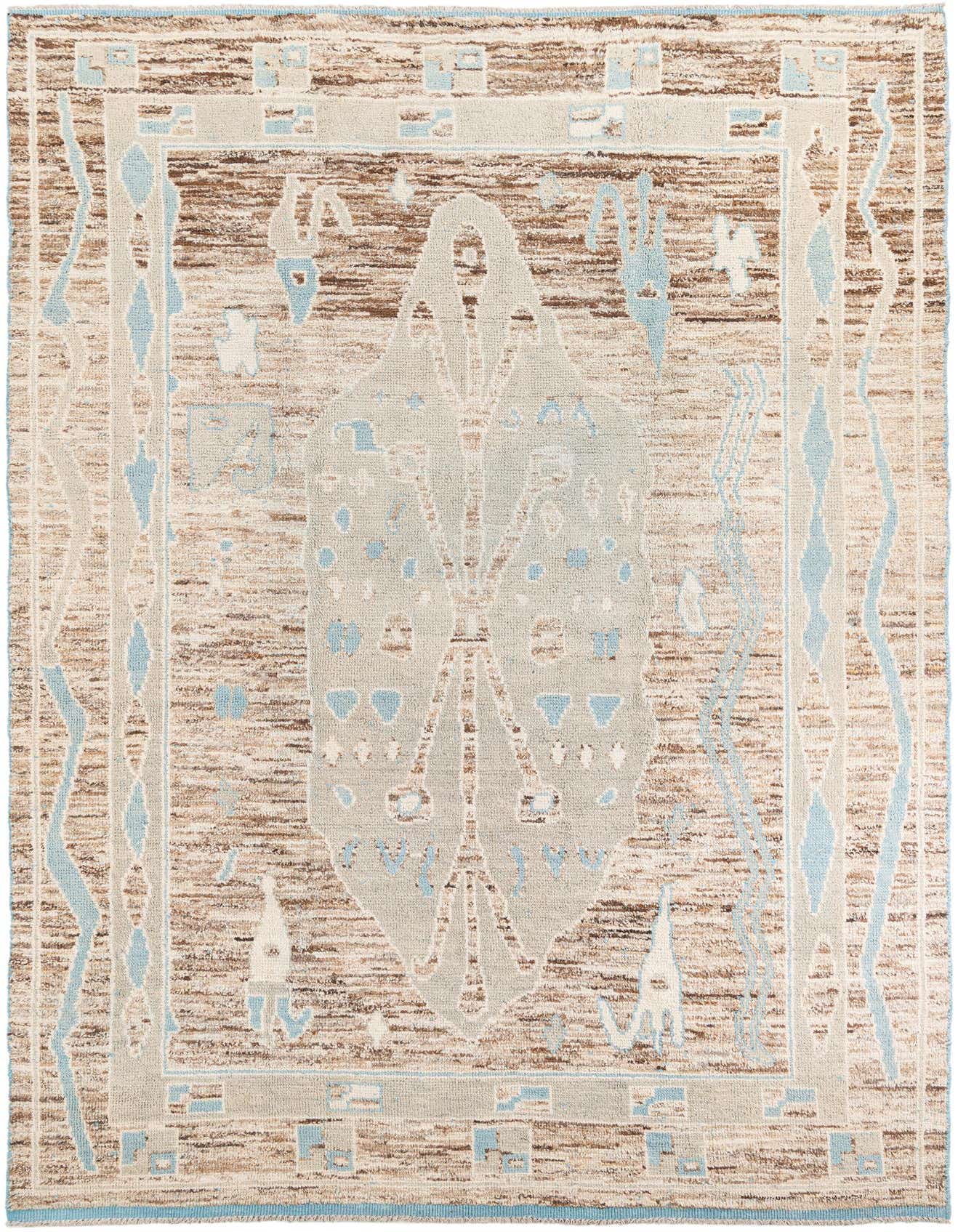 A 10x13 rectangular Moroccan shag rug with a multi-colored tribal pattern in brown, cream, and light blue.
