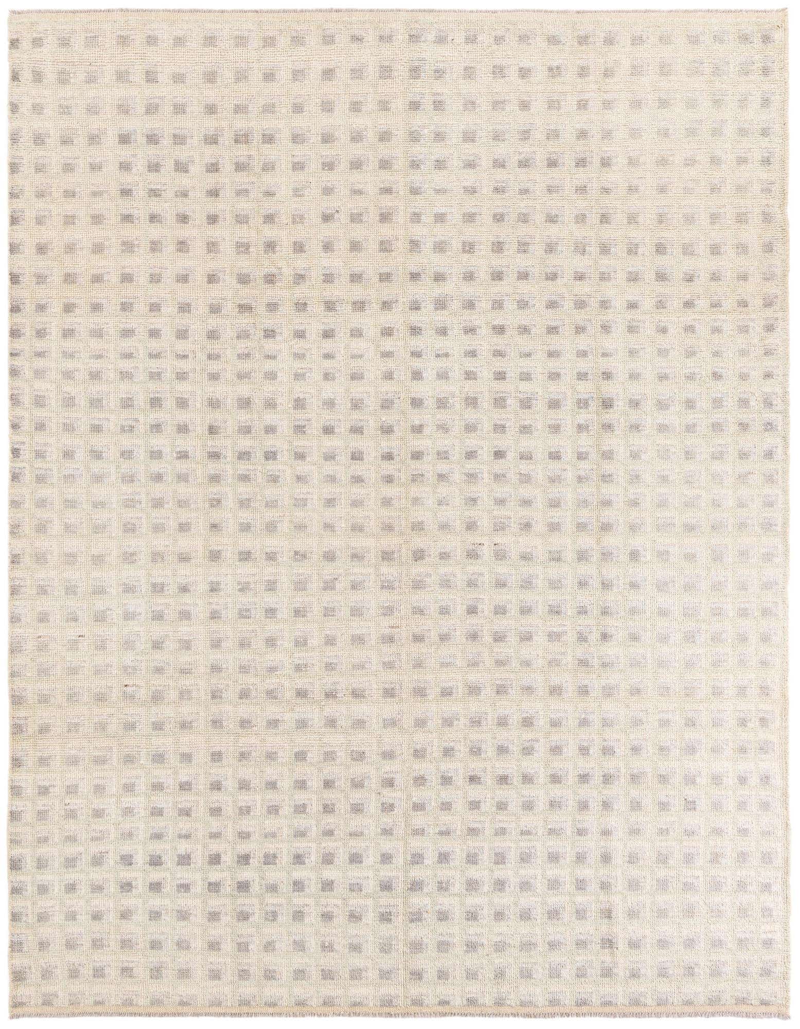 A rectangular 8x10 multi-colored wool shag rug featuring a grid of small grey squares on a cream background.