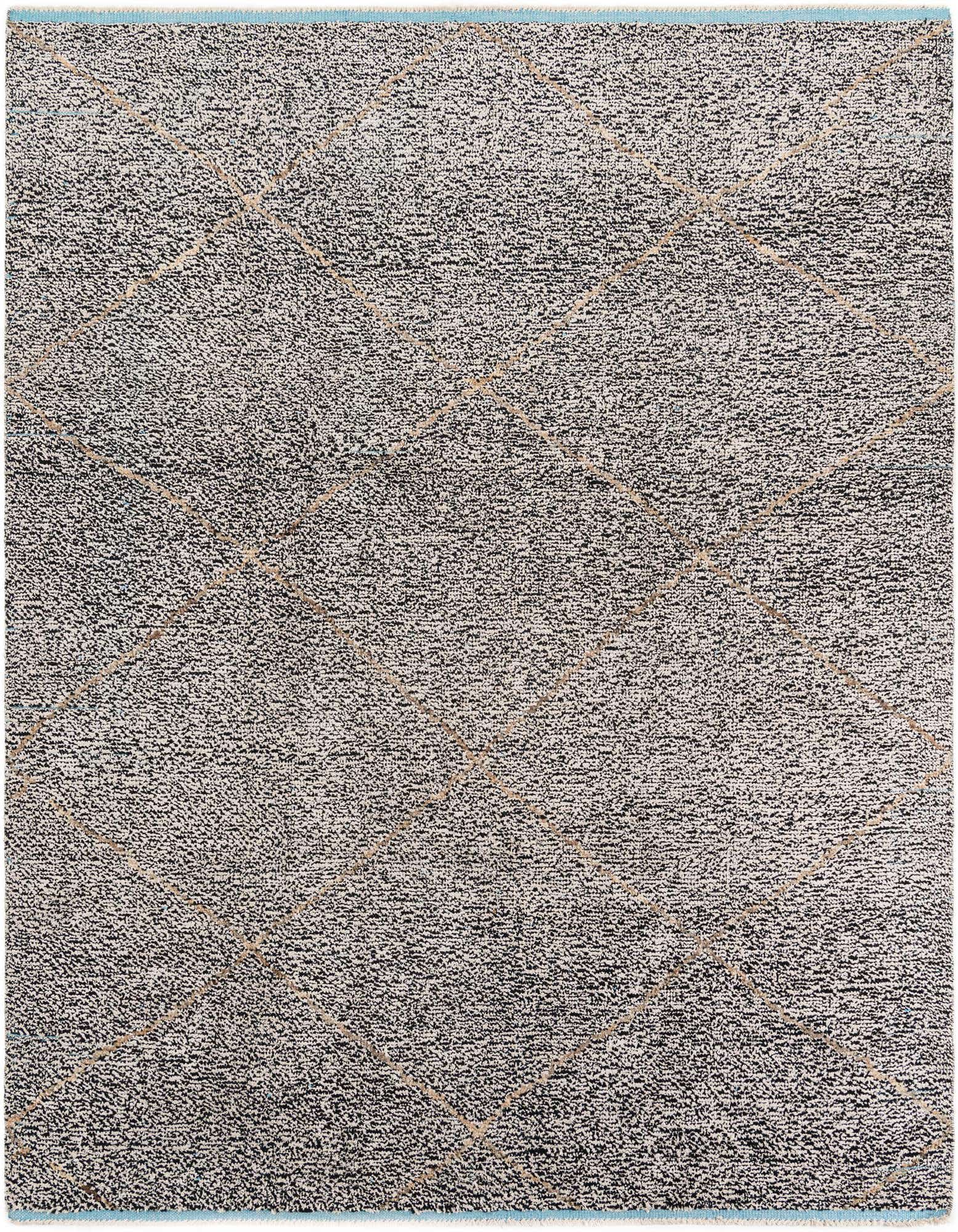 A rectangular 8x11 multi-colored shag rug with a modern tribal pattern, perfect for a living room.