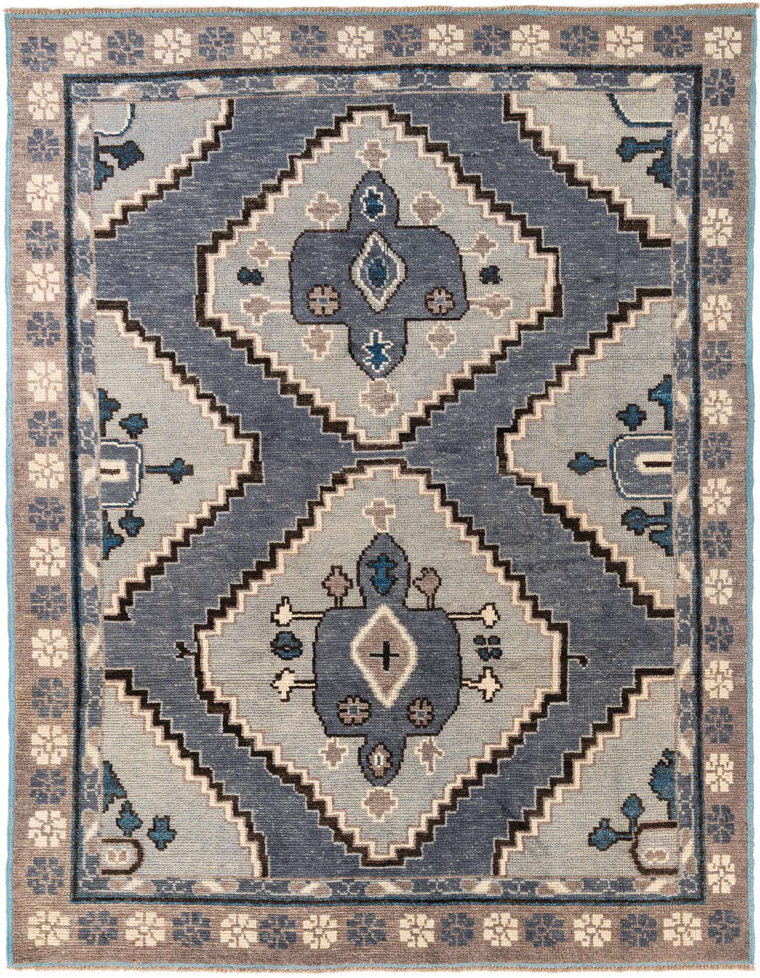 A rectangular 8x10 Moroccan tribal rug featuring a multi-colored medallion pattern in shades of blue, grey, and brown.