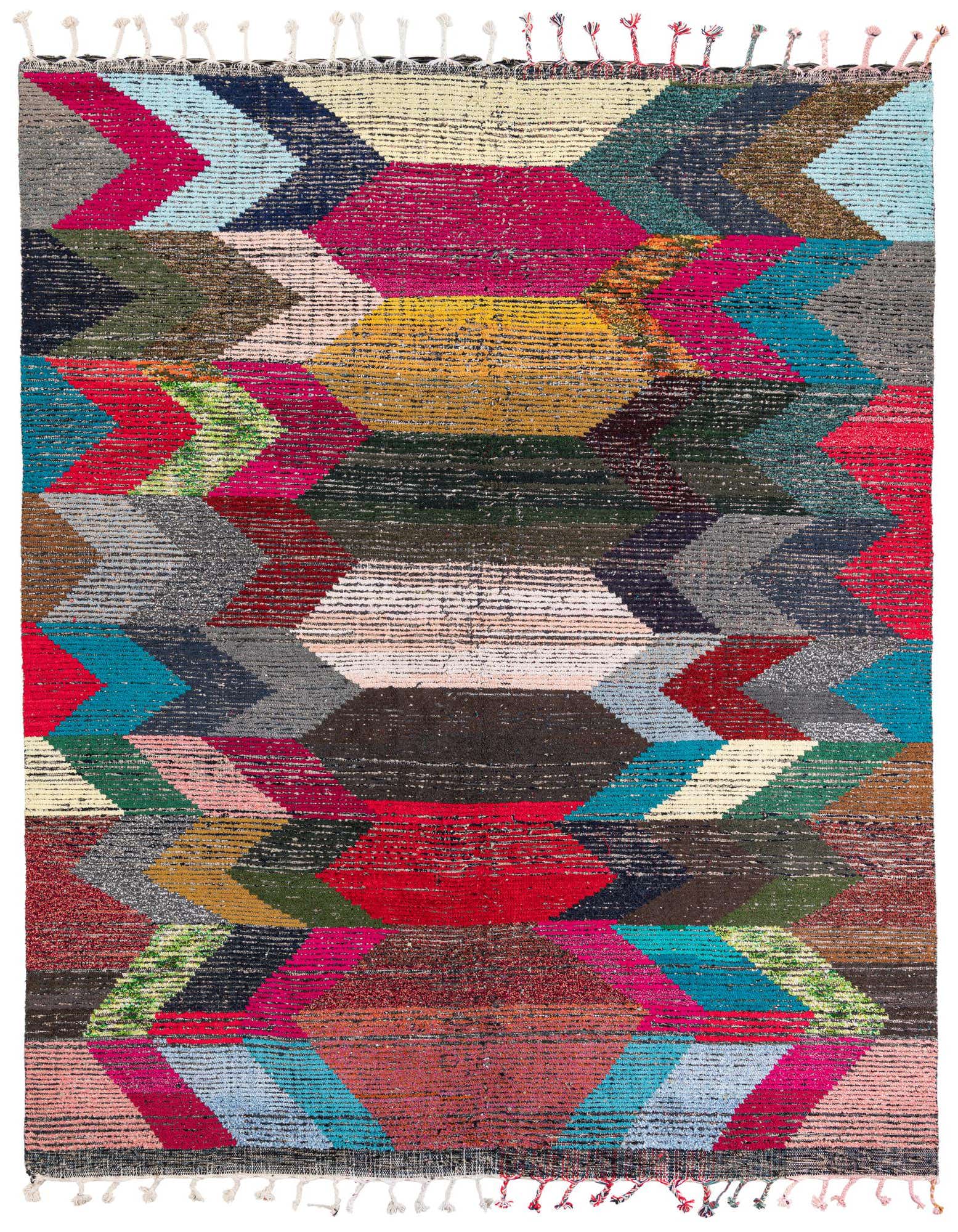 A vibrant 8x10 rectangular shag rug with a multi-colored tribal geometric pattern, featuring hues of red, blue, yellow, and green.