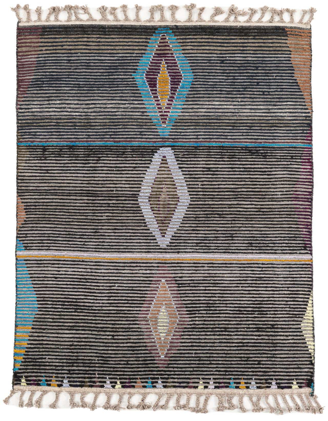 A 4x6 rectangular multi-colored wool shag rug with tribal diamond patterns and tassels, ideal for a living room.