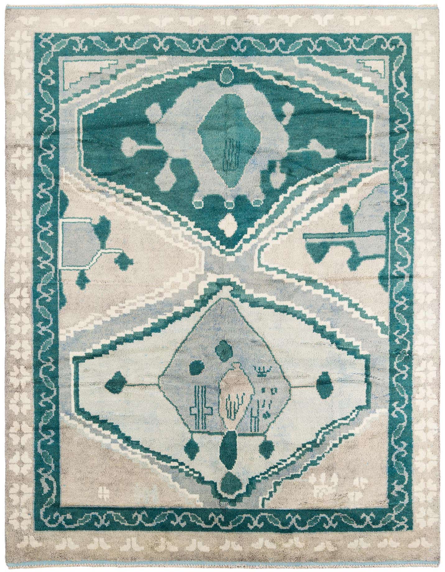 A 9x12 rectangular Moroccan shag rug with a tribal medallion pattern in teal, light blue, and beige.