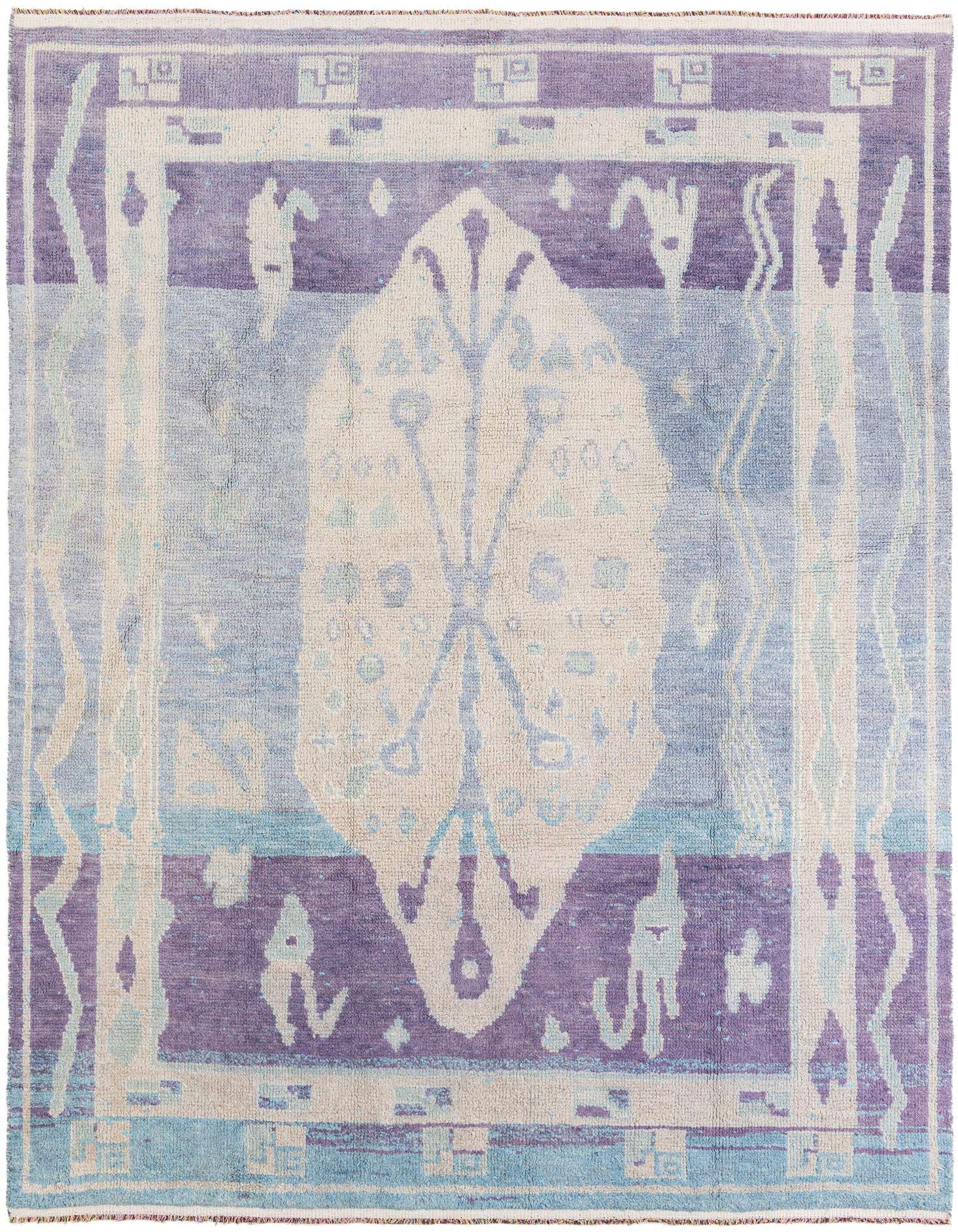 A rectangular 8x10 Moroccan shag rug with a multi-colored tribal medallion pattern in shades of purple, blue, and cream.