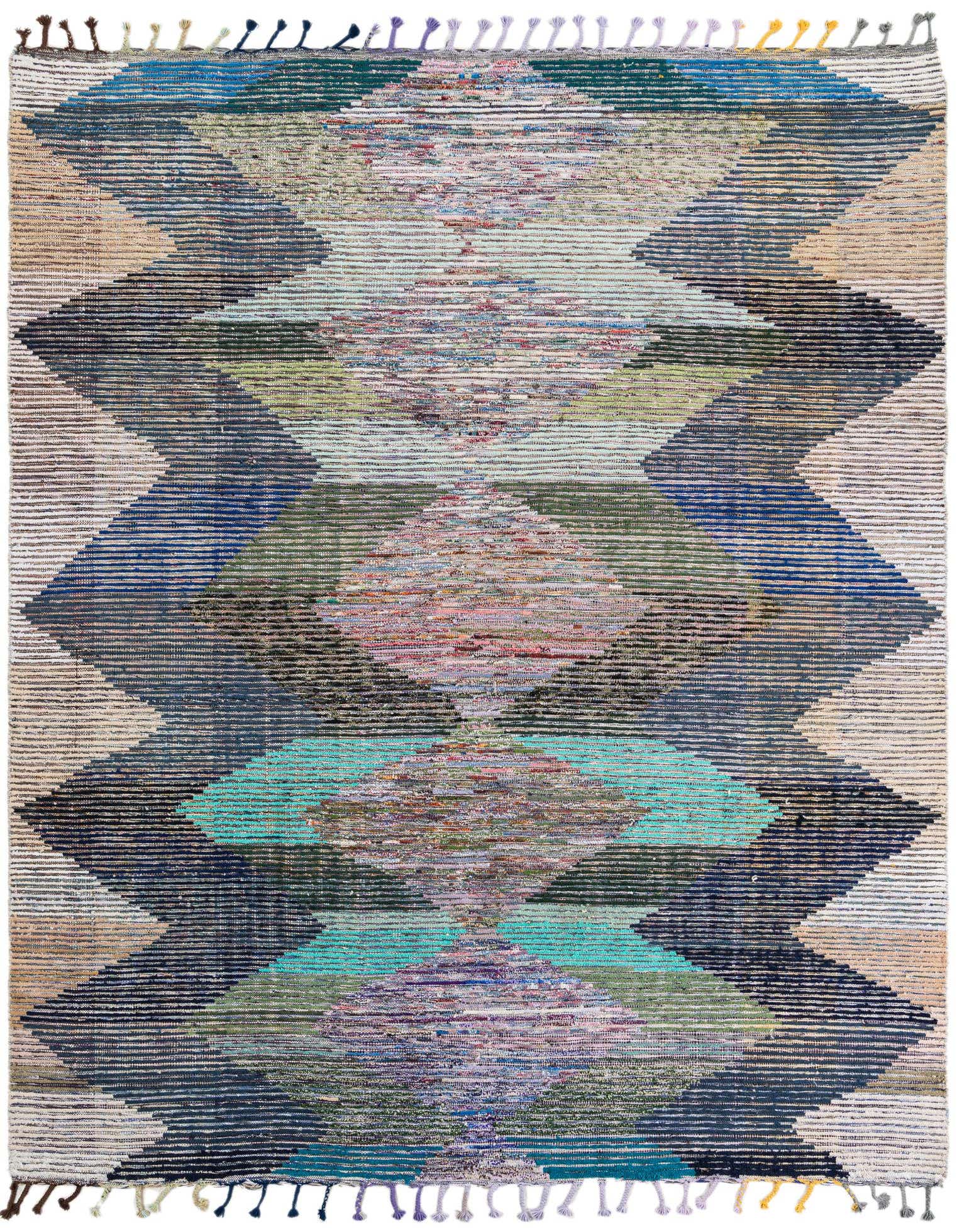 A colorful 8x10 rectangular shag rug with a tribal geometric pattern in shades of blue, green, pink, and beige.