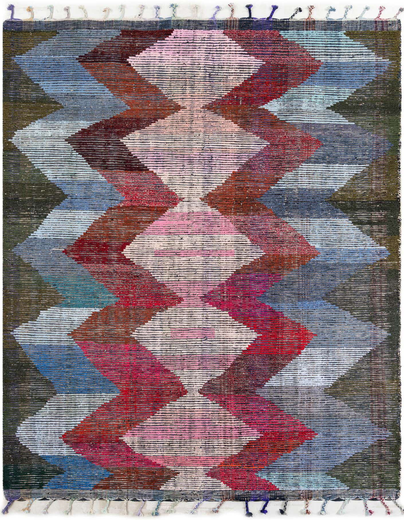 A 9x12 multi-colored rectangular wool shag rug with a vibrant tribal geometric pattern and decorative tassels.