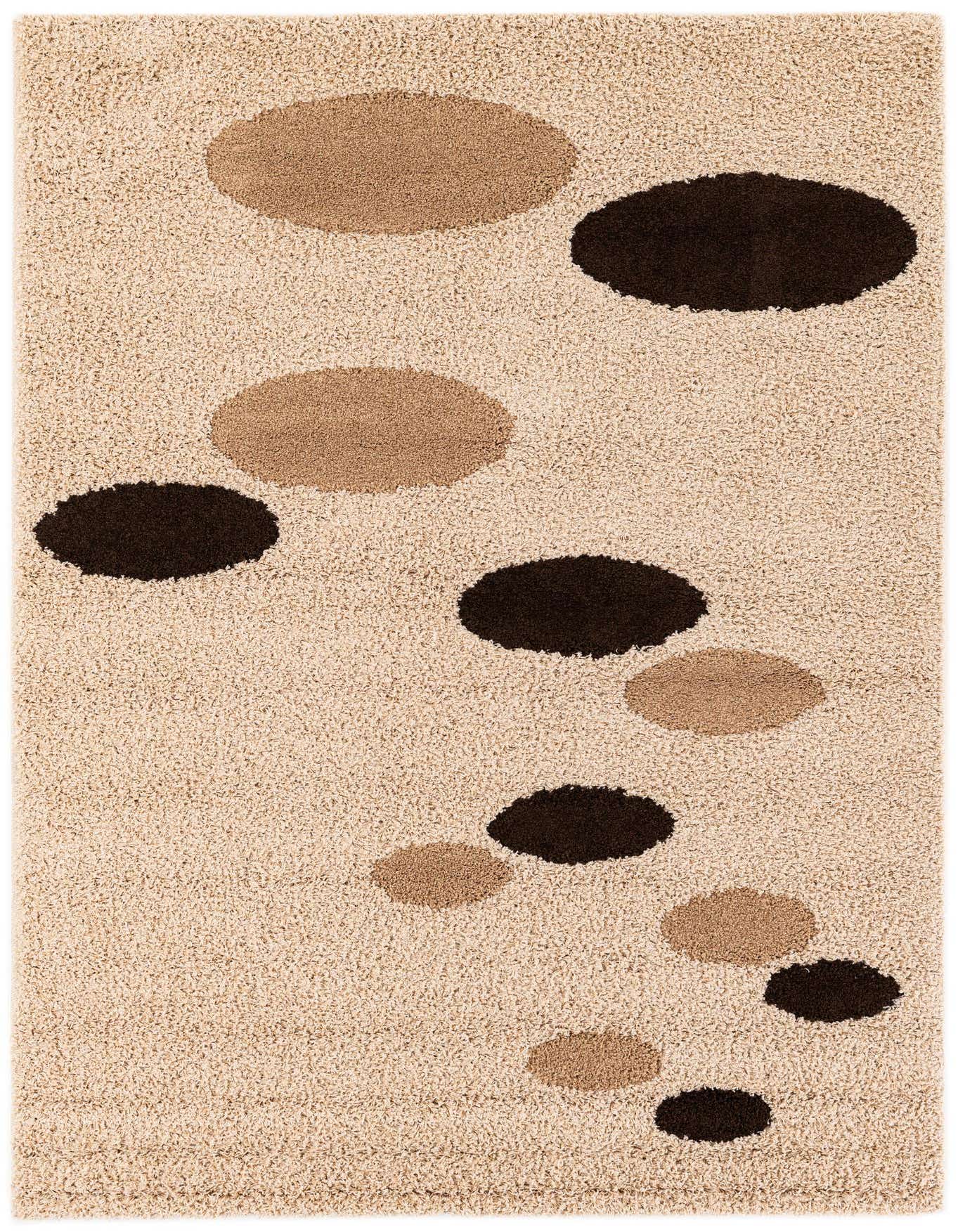 A rectangular 5x7 shag rug with a beige background and scattered oval shapes in varying shades of brown.
