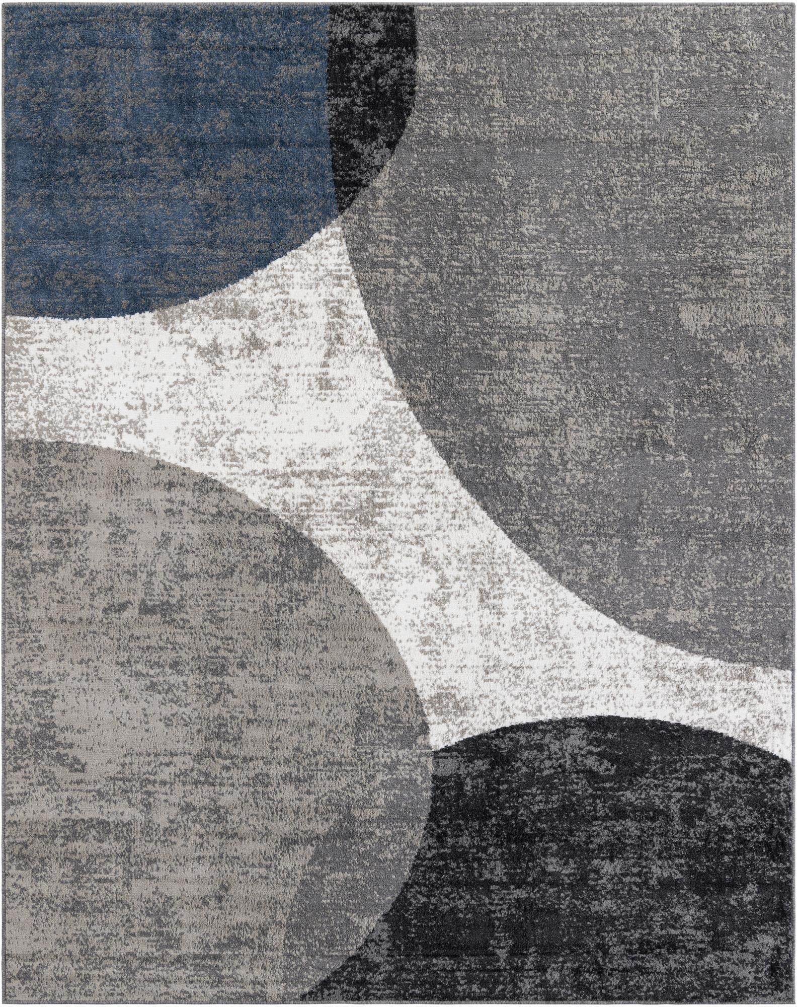A rectangular 8x10 modern abstract rug with large overlapping shapes in shades of blue, gray, black, and white.