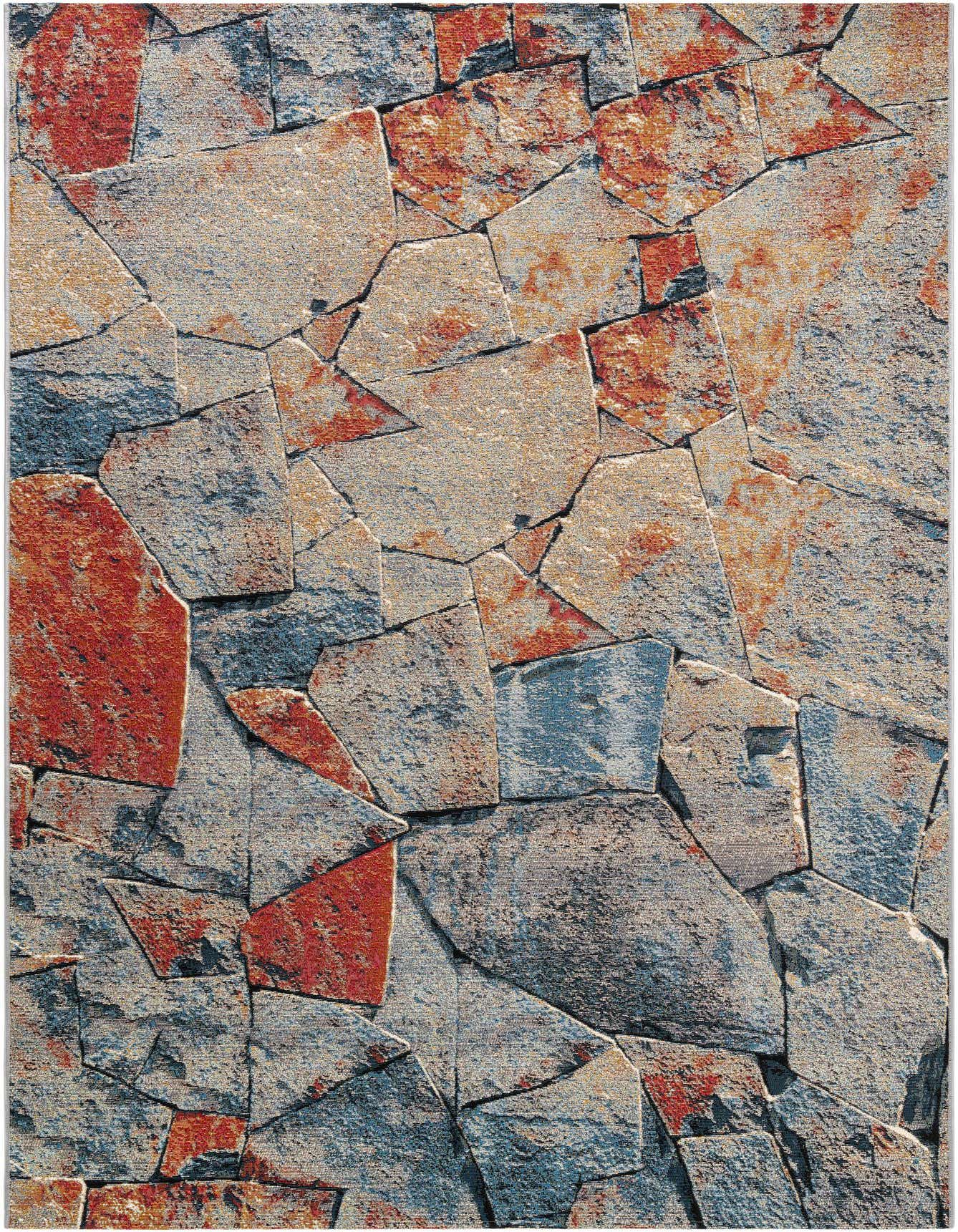 A 6x9 multi-colored rectangular rug with a modern abstract pattern resembling natural stone or slate tiles in various shades of grey, blue, and terracotta.