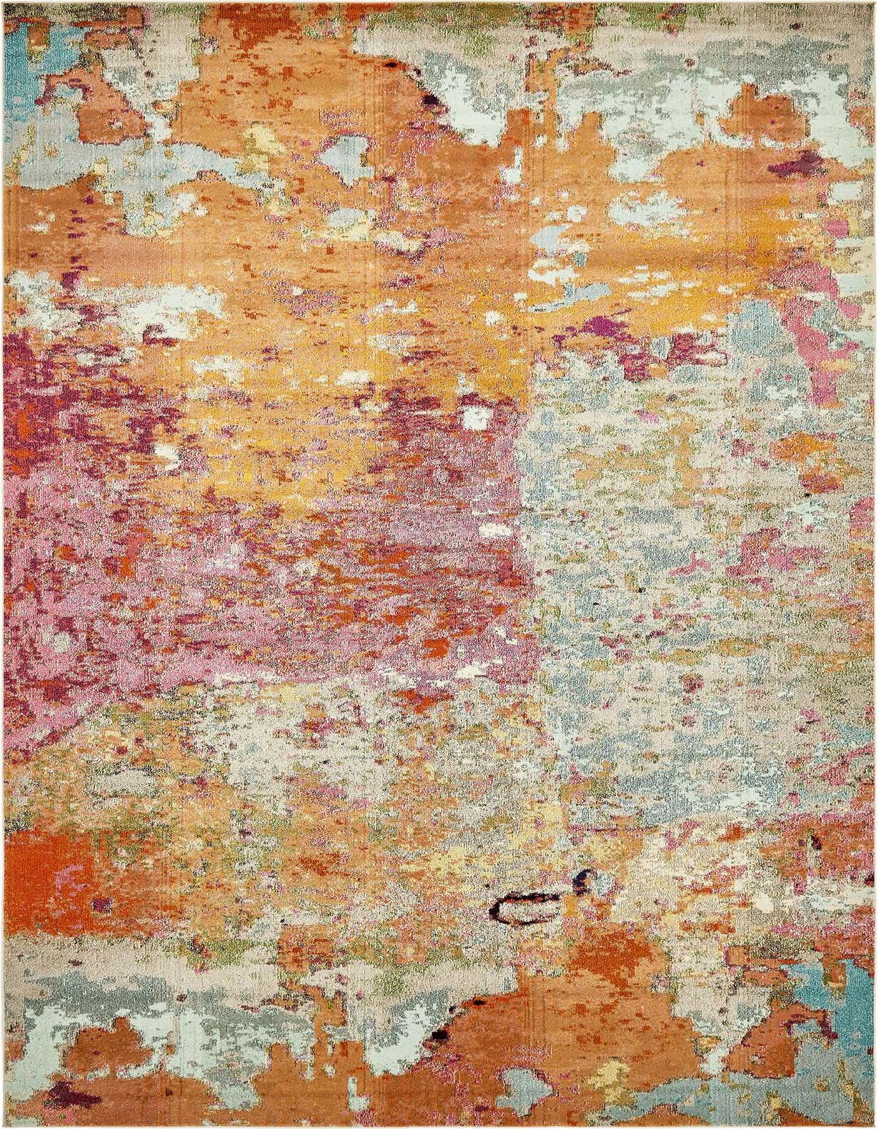A multi-colored rectangular area rug with an abstract, painterly design in shades of orange, pink, blue, and cream.