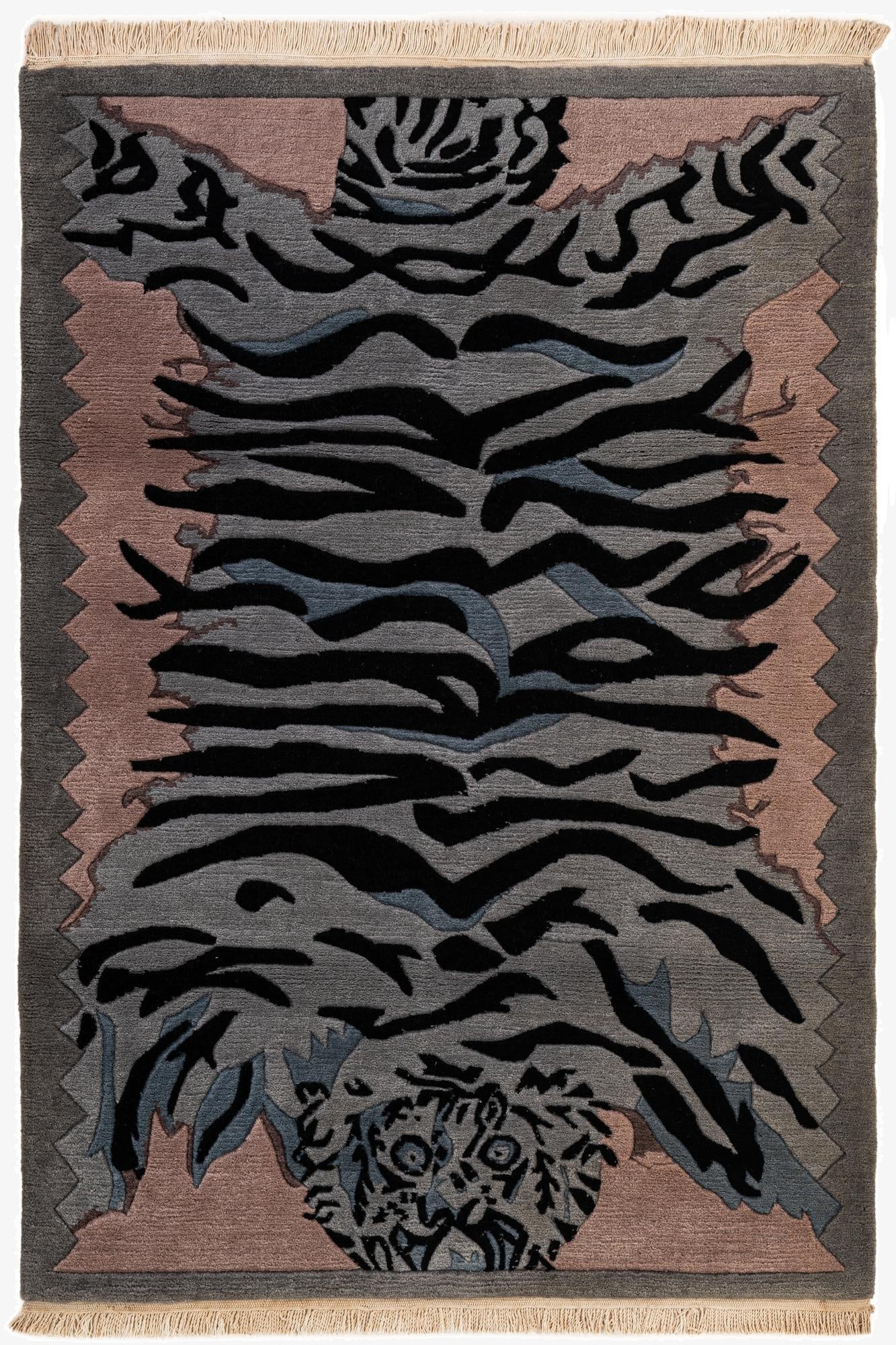 A 4x6 multi-colored rectangular wool rug with a modern tiger stripe pattern in shades of grey, black, and blue, with pink accents and fringe.