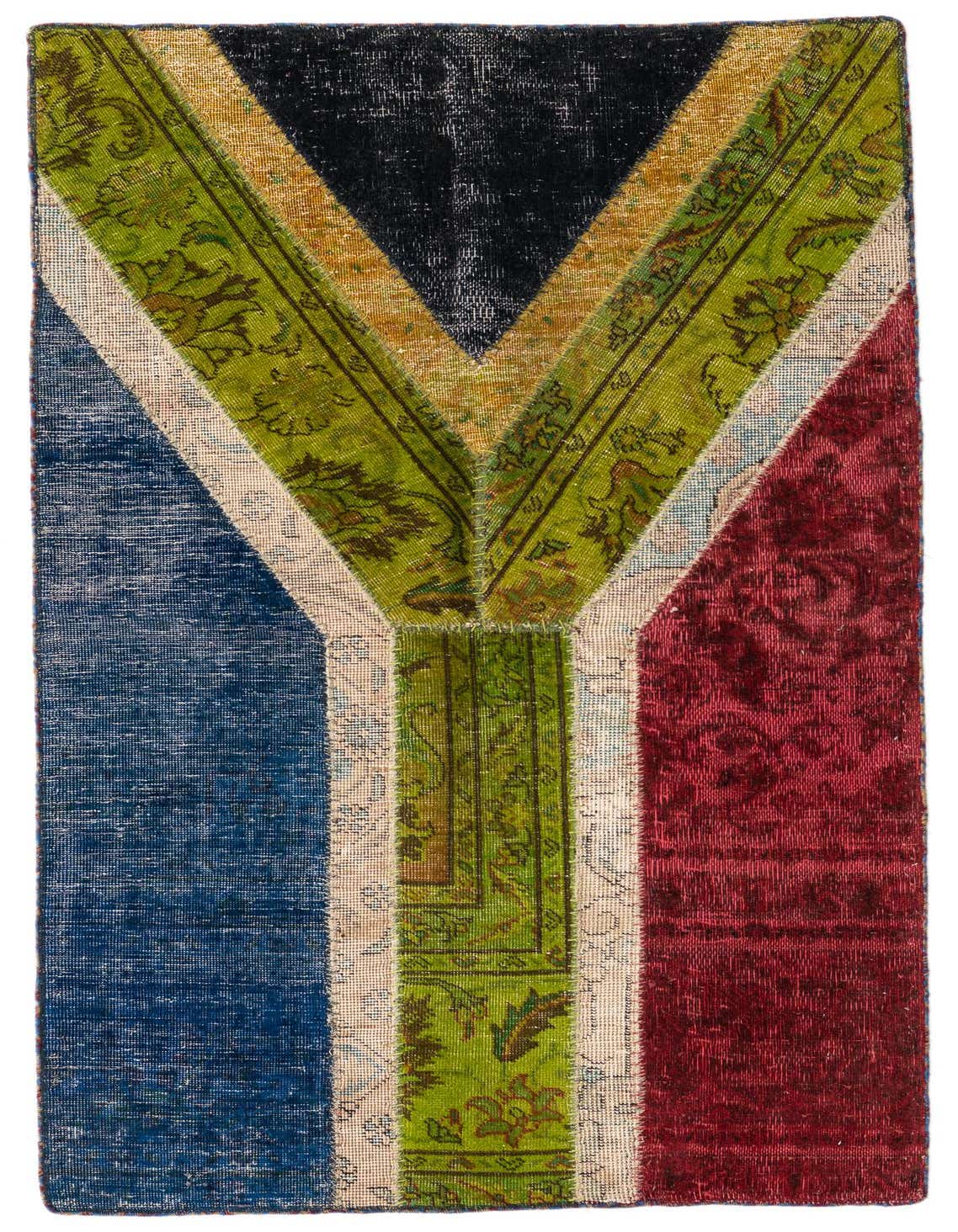 A rectangular 3x5 multi-colored patchwork rug with a bold V-shape design in green, gold, black, blue, and red, featuring distressed Persian patterns.