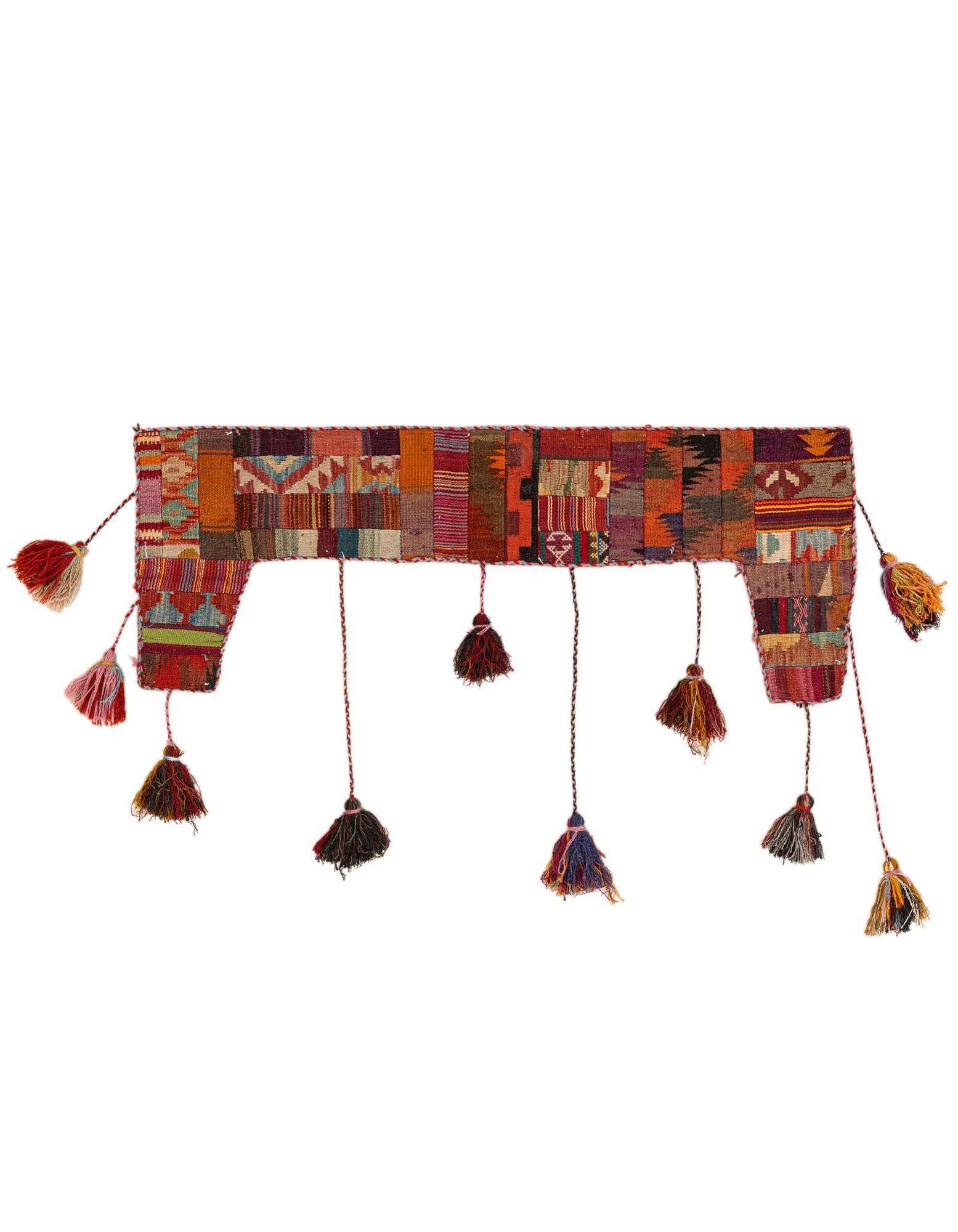 A vibrant 2x3 multi-colored rectangular wool rug with a modern abstract pattern and decorative tassels.