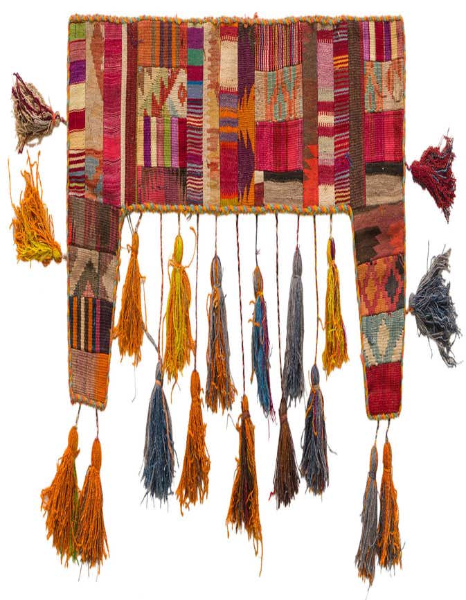 A vibrant, multi-colored rectangular wool wall art piece with an abstract pattern and numerous tassels hanging from the bottom and sides.